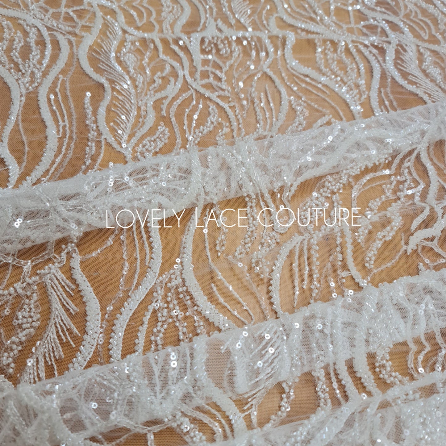 LL-1374, luxurious bridal lace fabric with modern abstract wave pattern in off-white color, starts at 0,5Meter