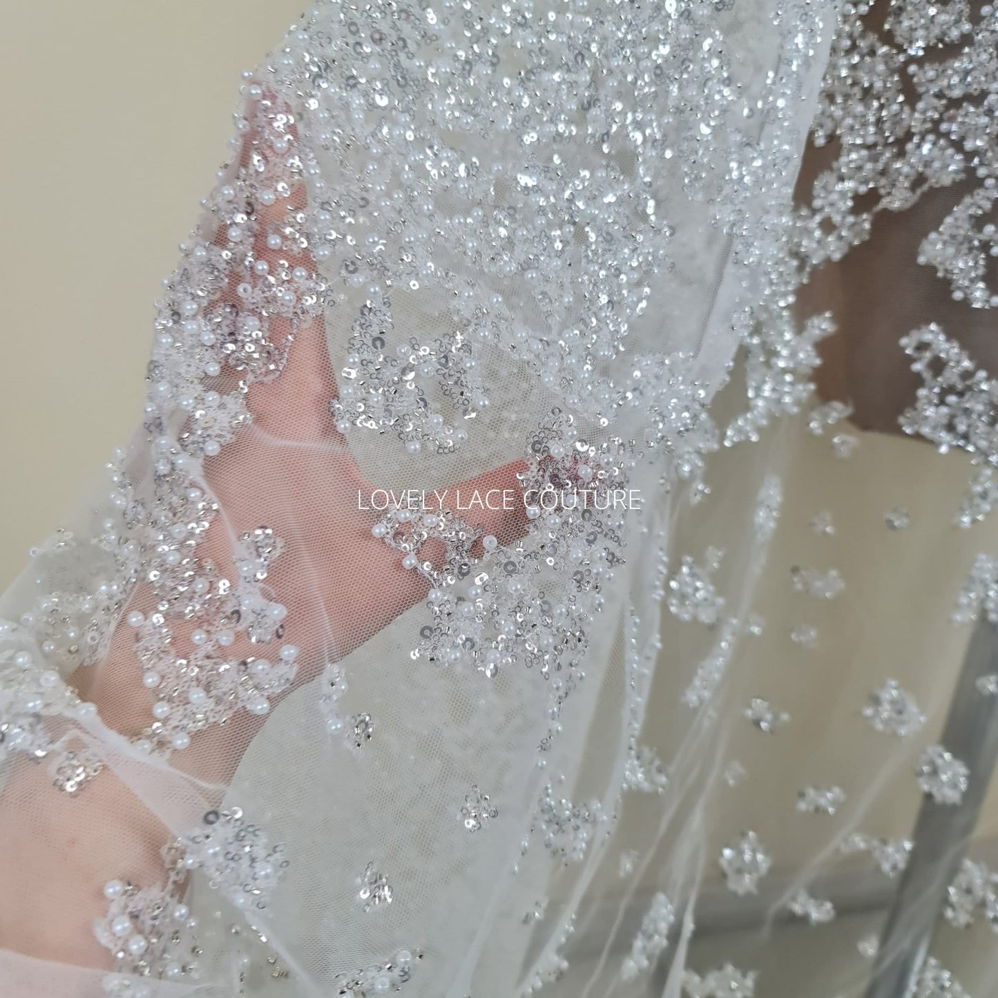 lace fabric with beads and silver sequins in off-white color