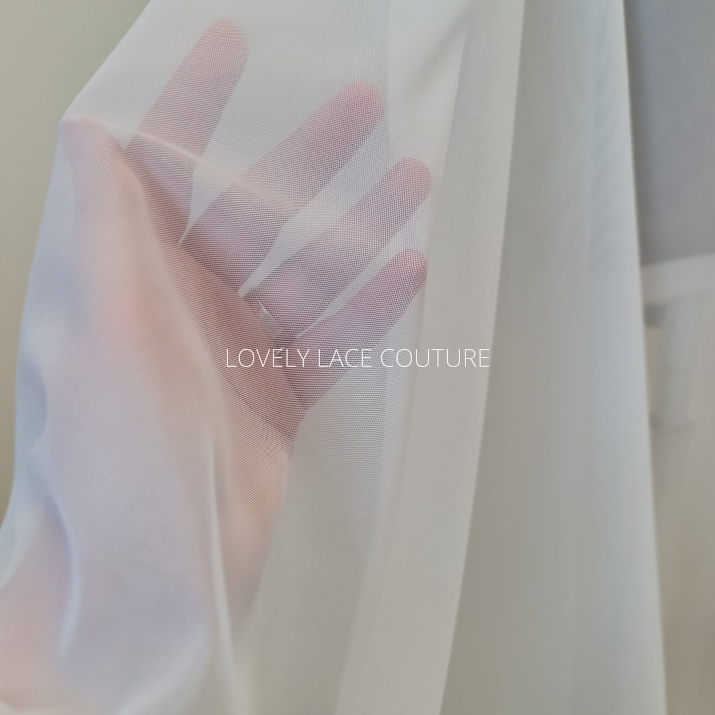 100cm length, 160cm wide, transparent Mesh Fabric in light-ivory color, slightly stretchy, perfect as lining for bridal dresses