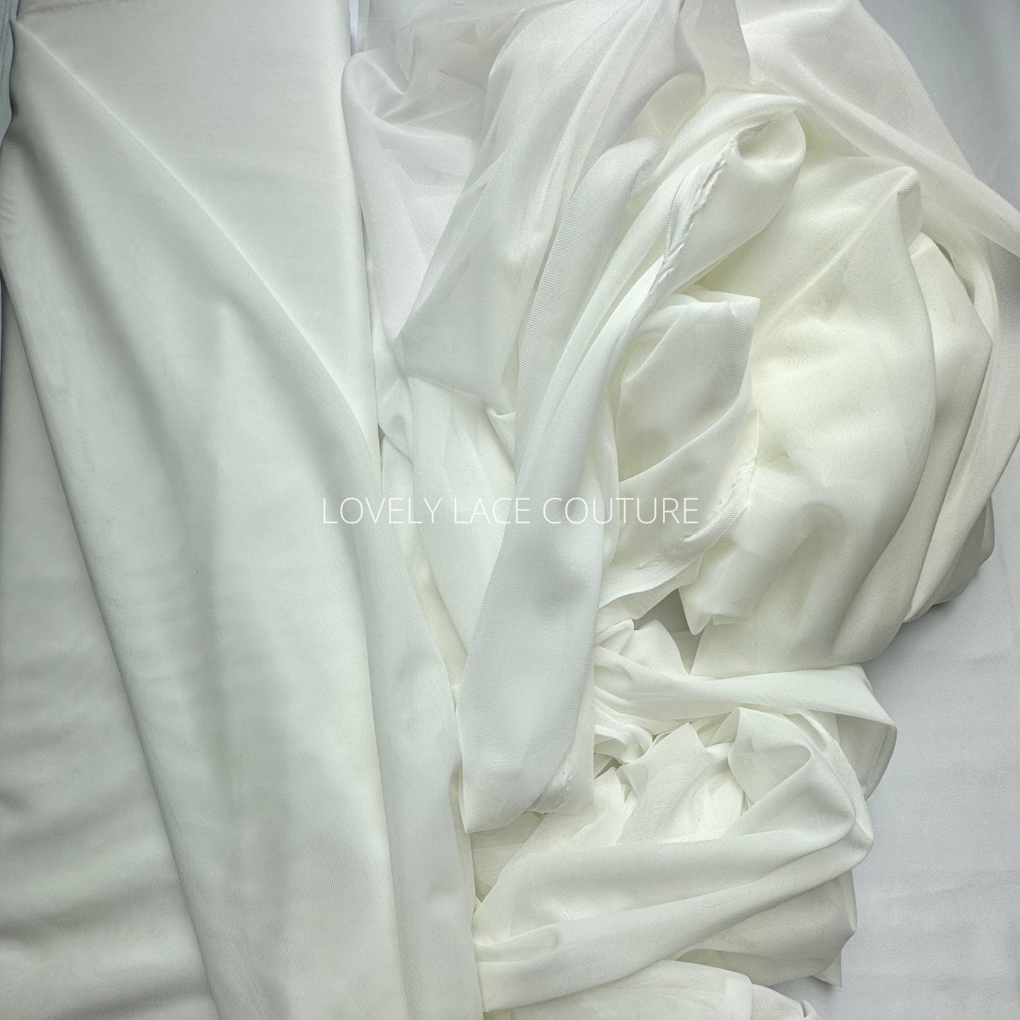 100cm length, 160cm wide, transparent Mesh Fabric in light-ivory color, slightly stretchy, perfect as lining for bridal dresses