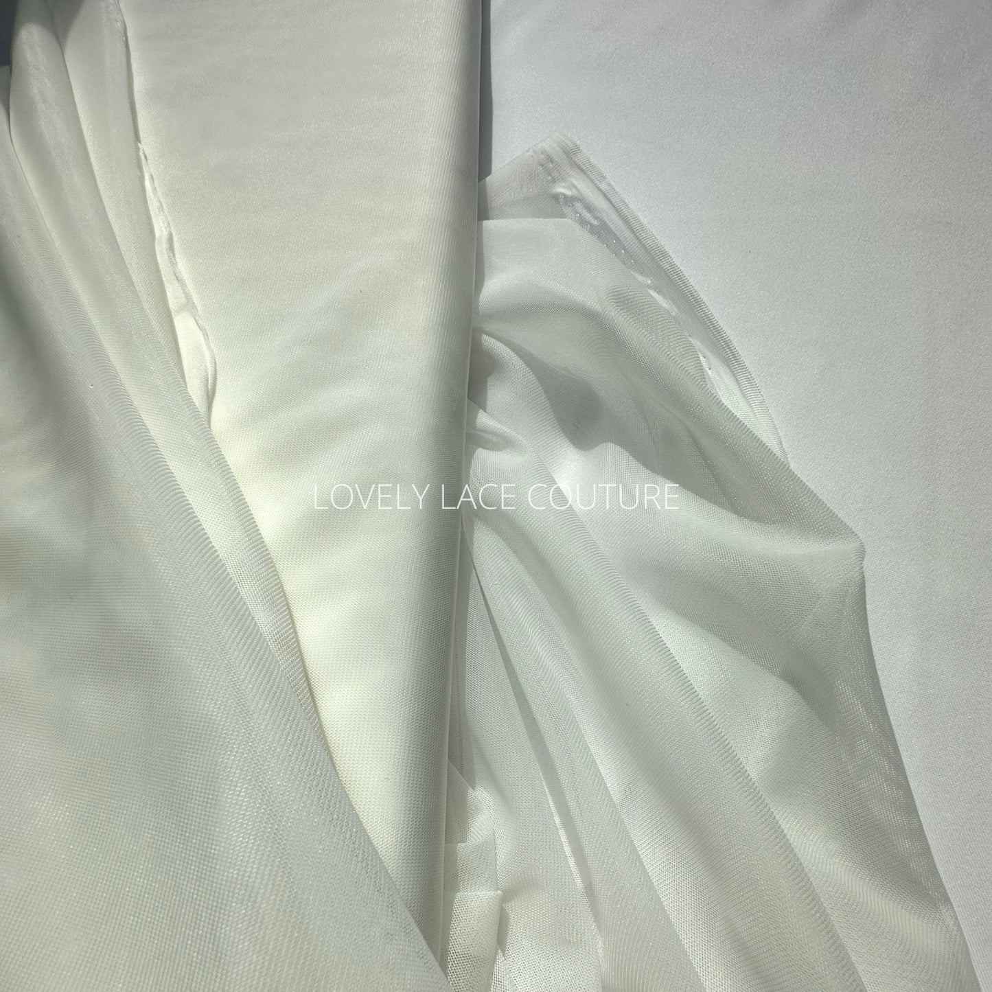 100cm length, 160cm wide, transparent Mesh Fabric in light-ivory color, slightly stretchy, perfect as lining for bridal dresses