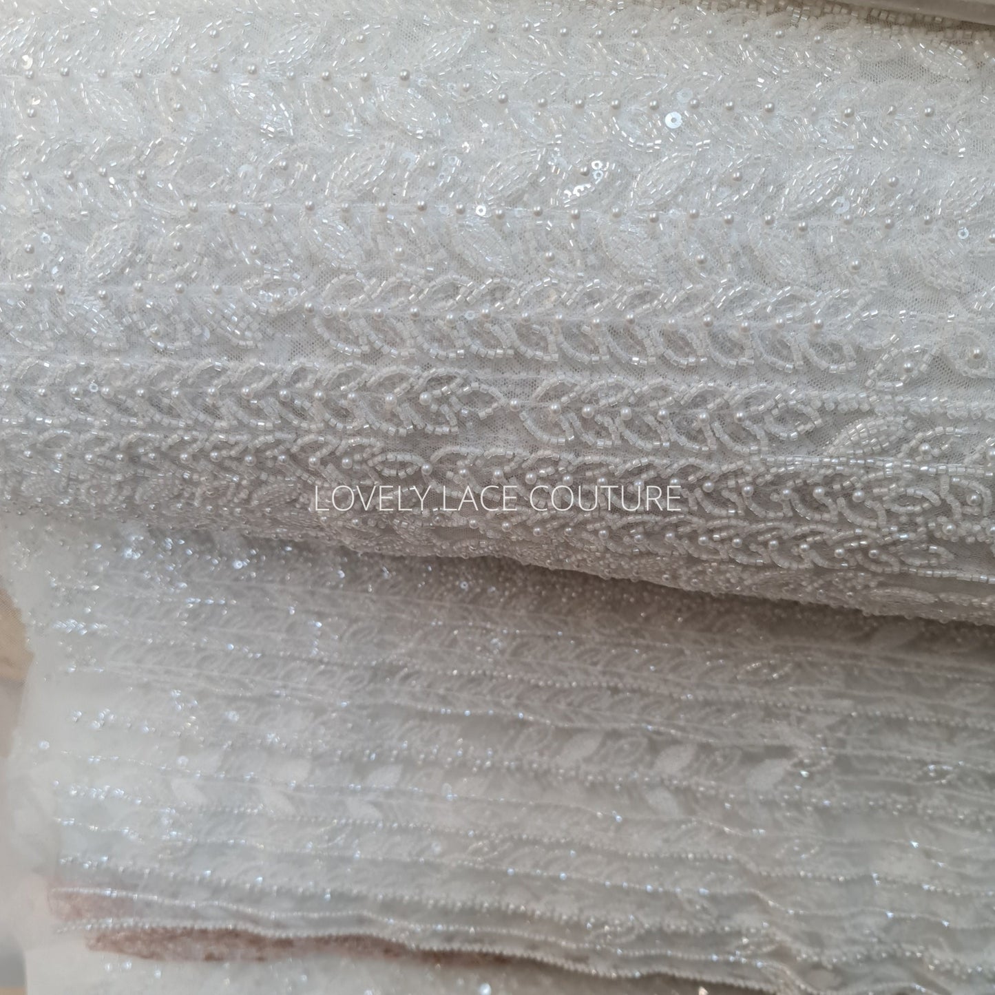 LL-1563, off-white bridal lace fabric with beads and sequins in a modern gorgoues geometrical design, fabric per meter