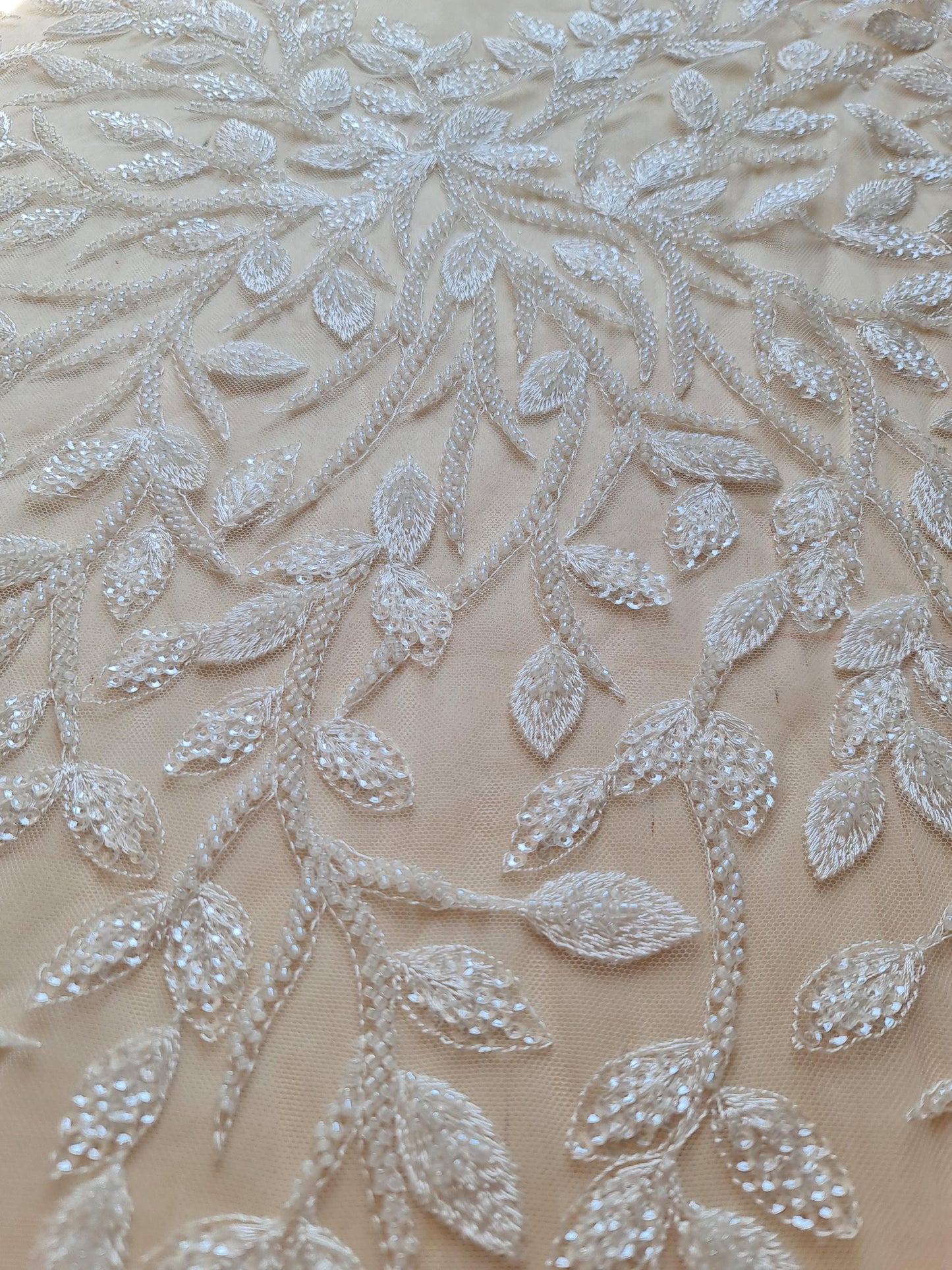 lace fabric with leafs with beads and transparent sequins, branch pattern, in white color