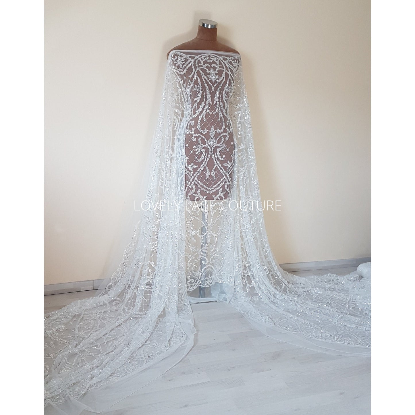 ornamental lace fabric in off-white color