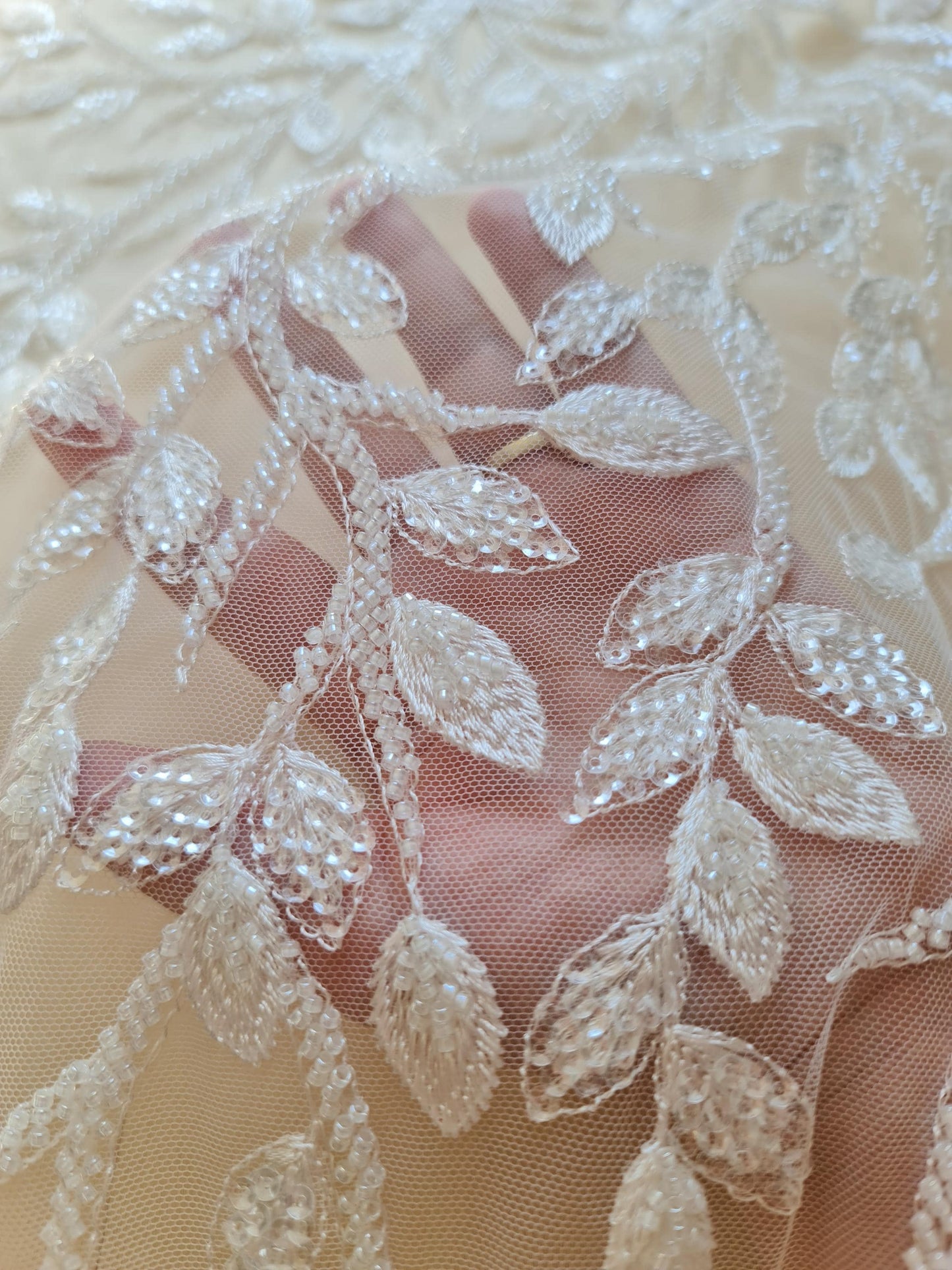 lace fabric with leafs with beads and transparent sequins, branch pattern, in white color