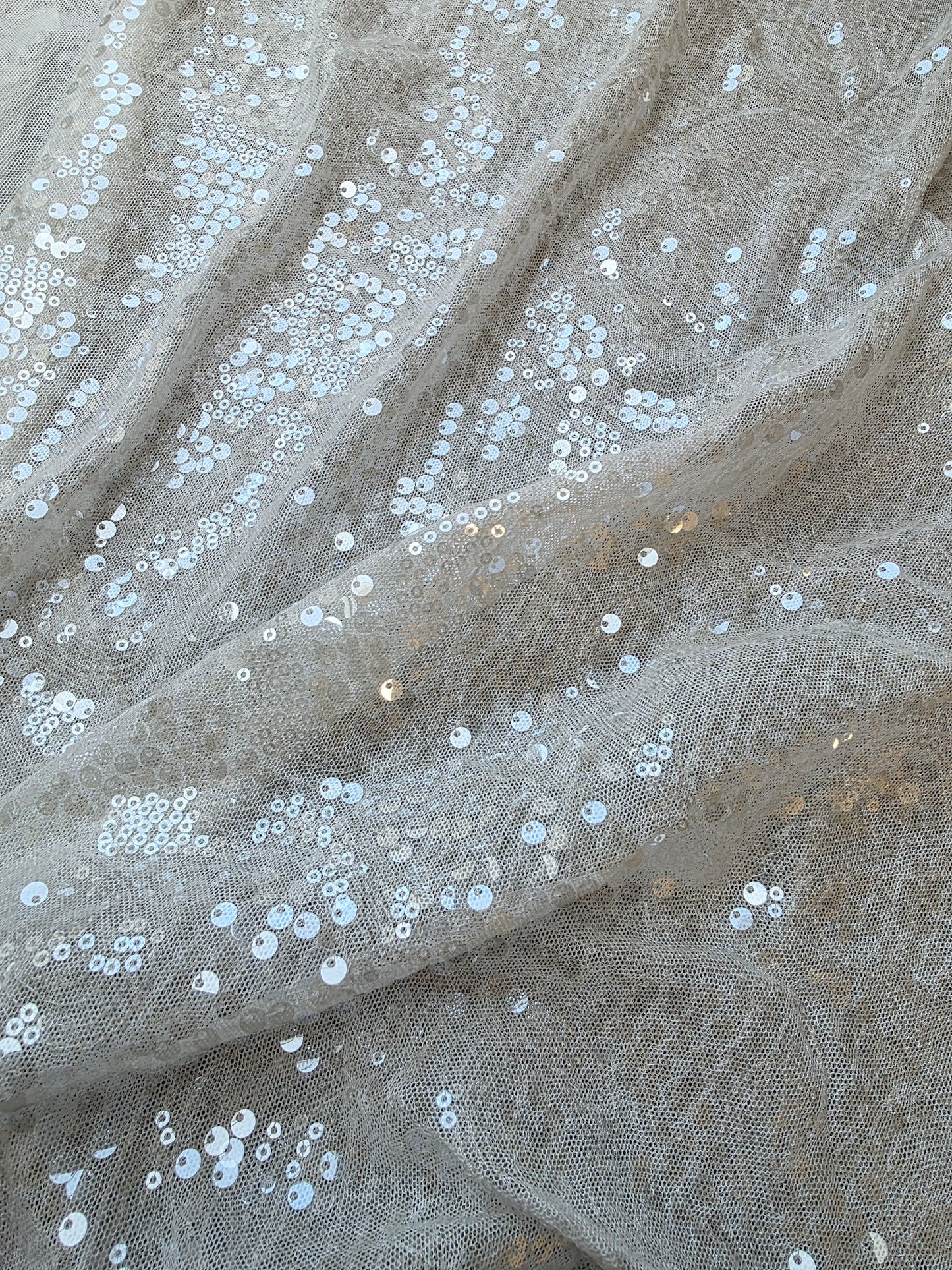 LL-1592, transparent meshfabric with big and small sequins in off-white color