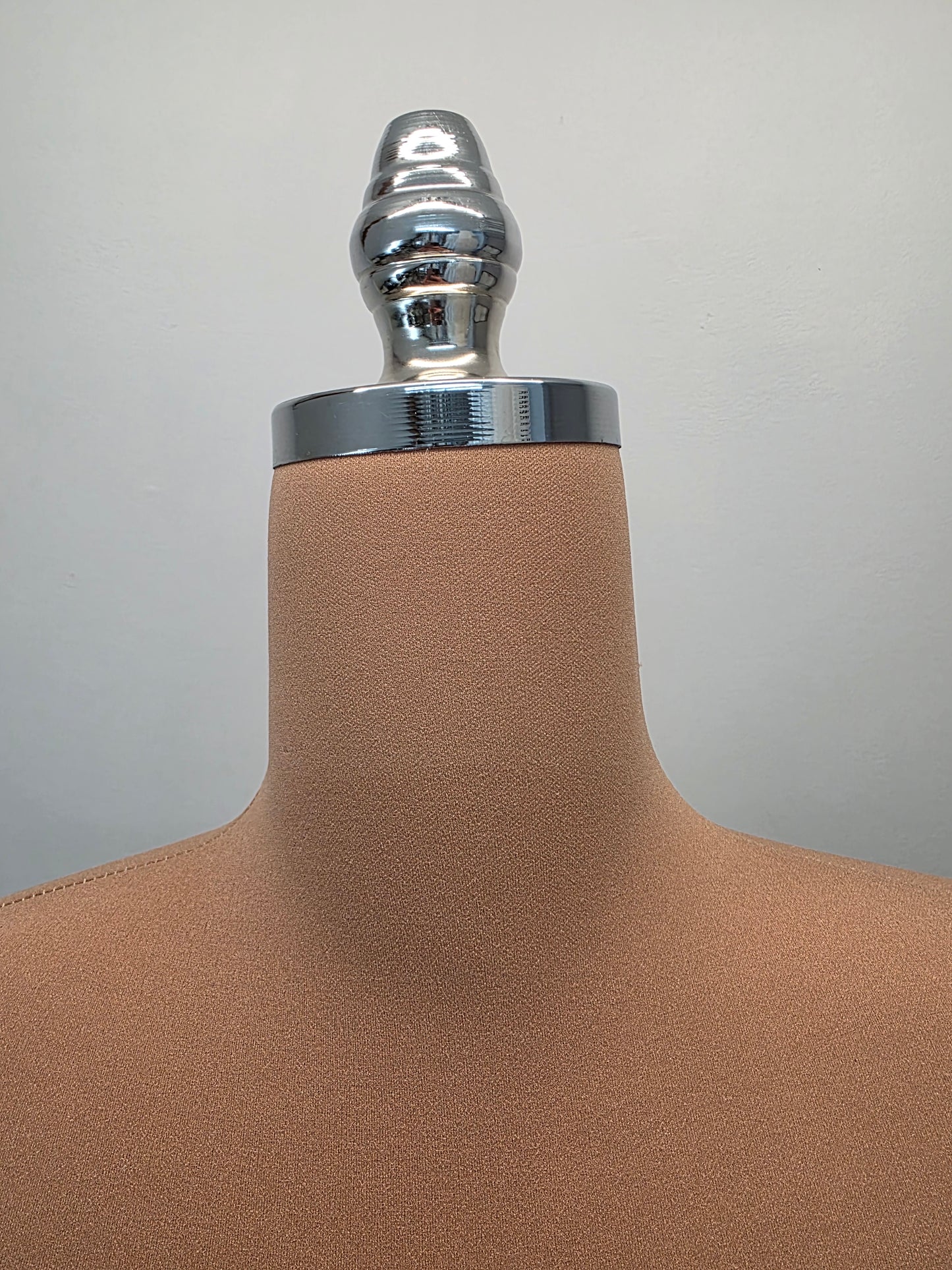 hourglass-shaped dress form, ideal for draping and presenting design ideas