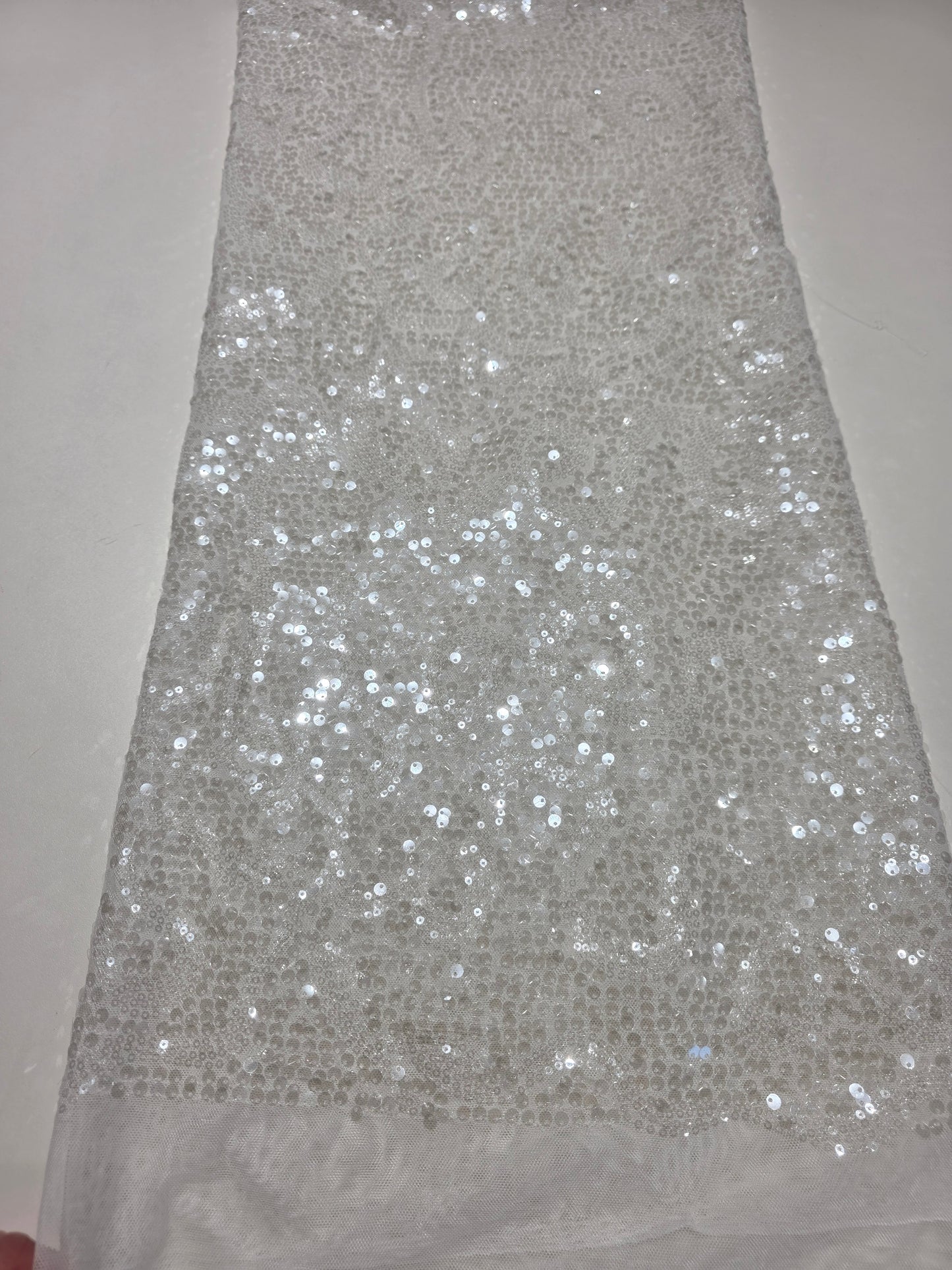 LL-1592, transparent meshfabric with big and small sequins in off-white color