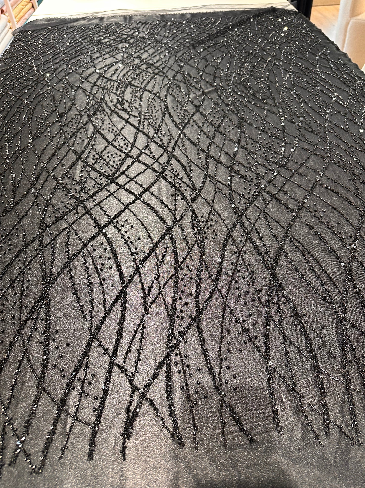 LL-1593, beaded black lace fabric with abstract wave design