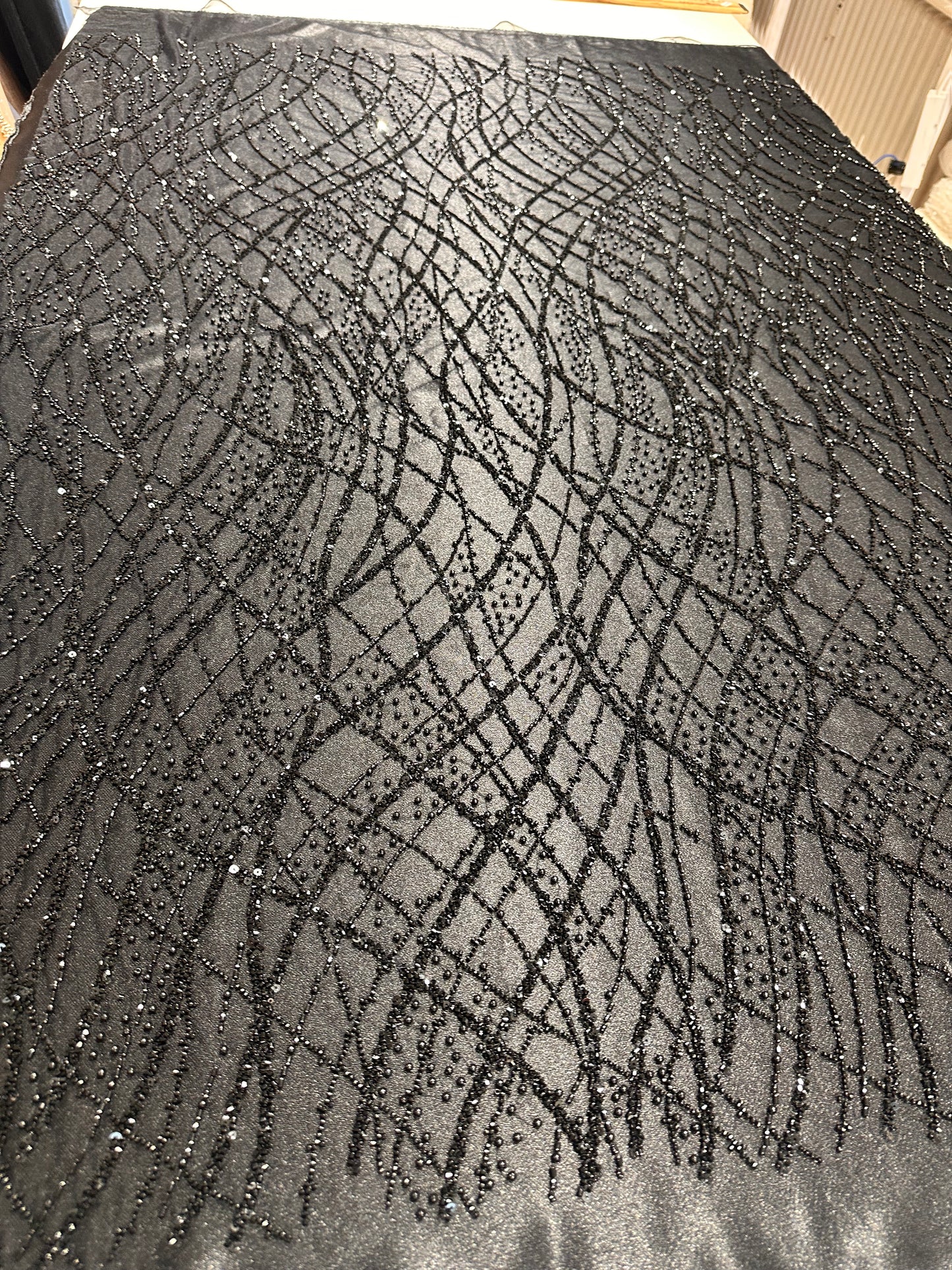 LL-1593, beaded black lace fabric with abstract wave design