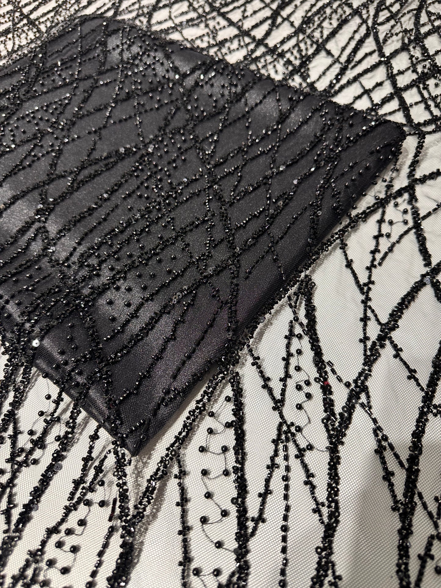 LL-1593, beaded black lace fabric with abstract wave design