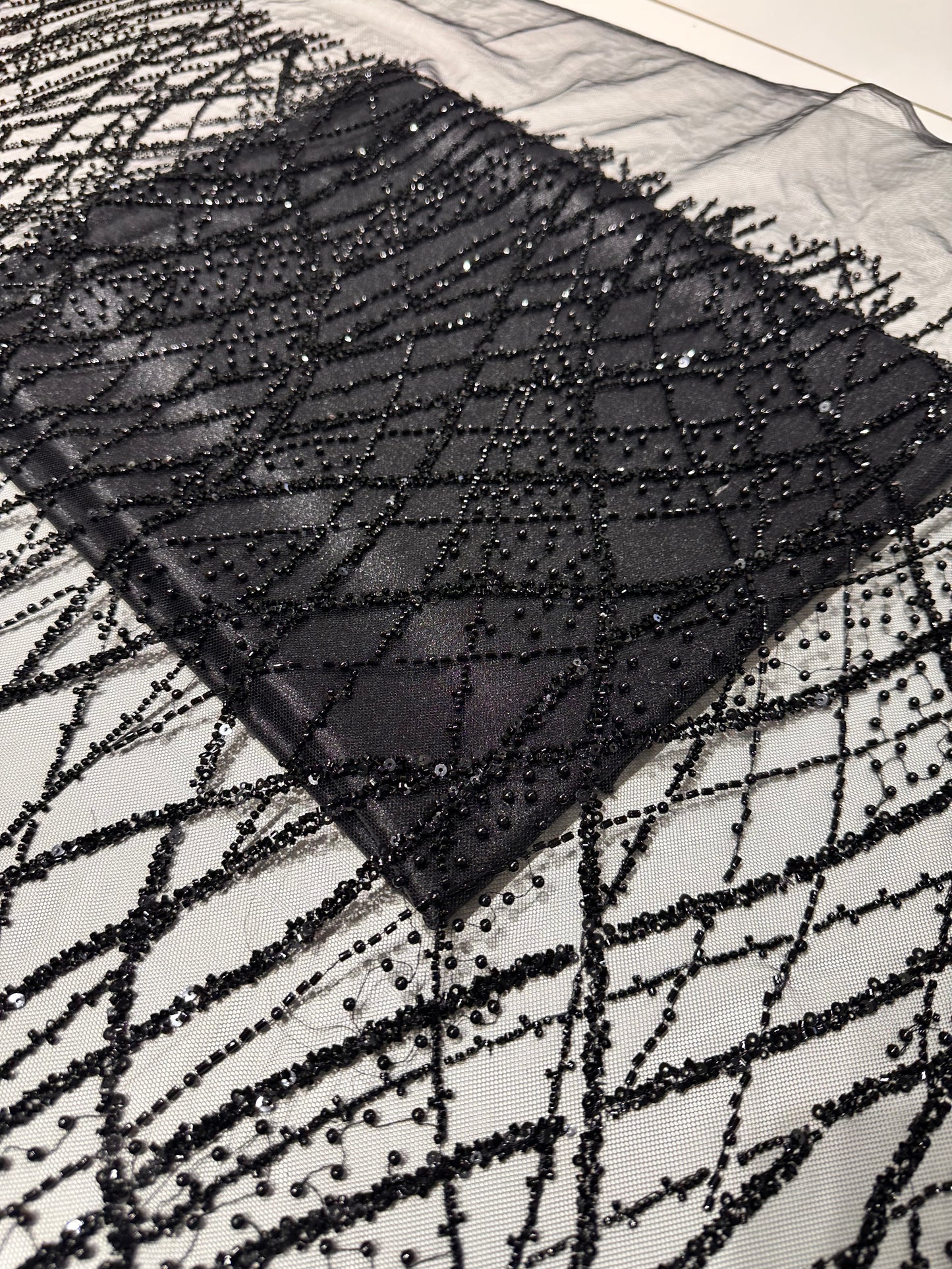 LL-1593, beaded black lace fabric with abstract wave design