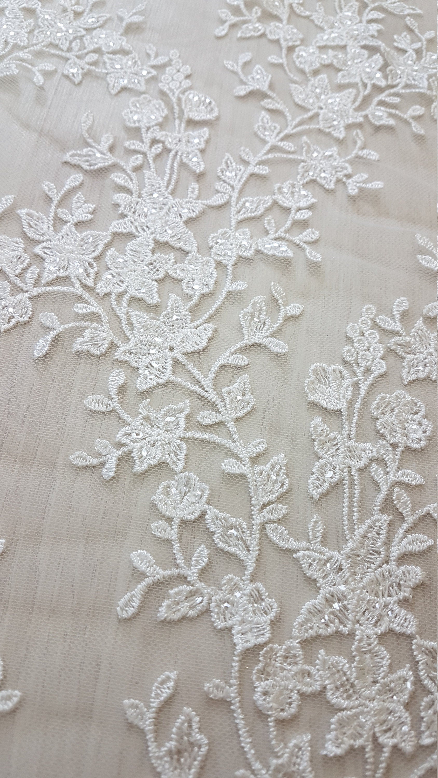 off-white lace fabric with flower pattern
