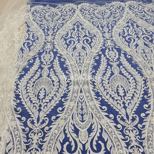 ornamental lace fabric in off-white color