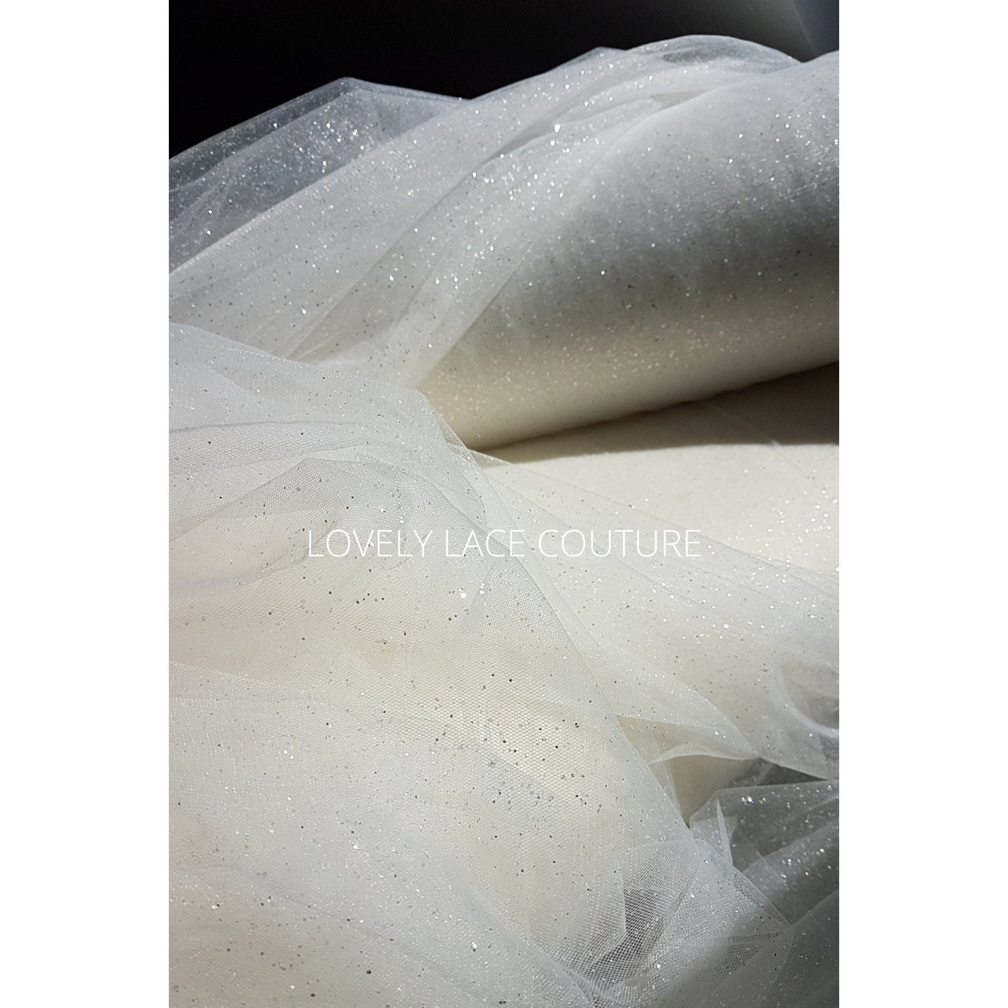 glitter tulle fabric for bridal veils and wedding dresses in off-white and ivory color