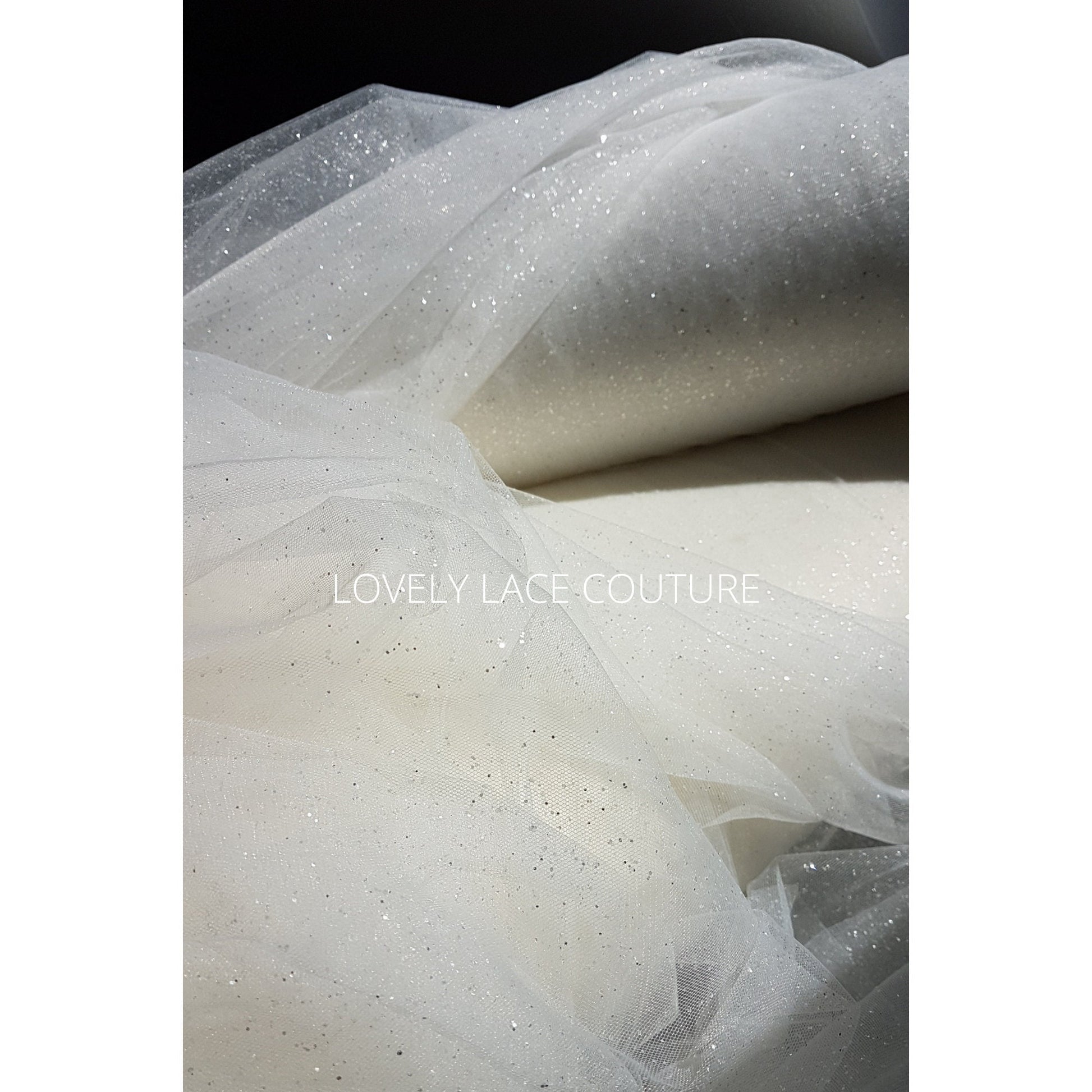 glitter tulle fabric for bridal veils and wedding dresses in off-white and ivory color