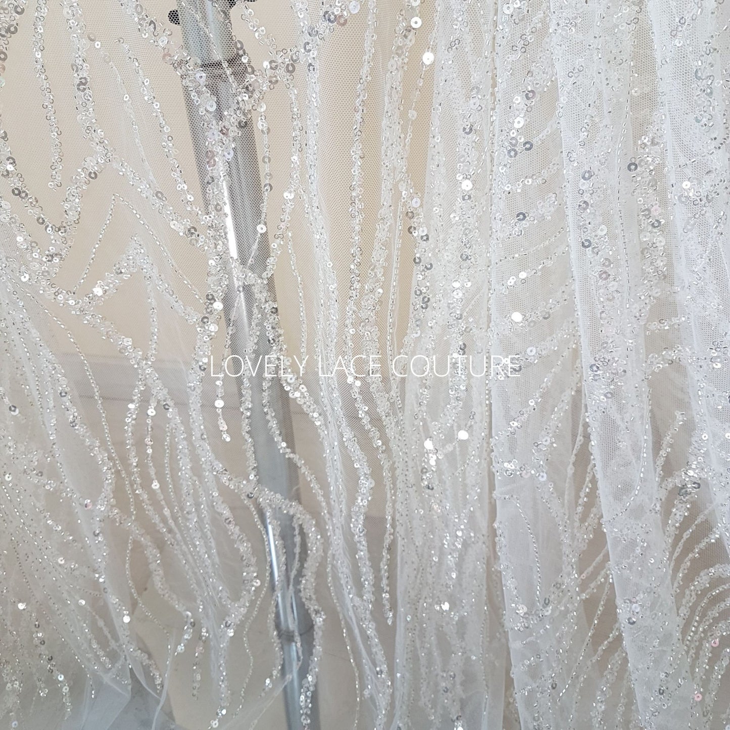 lace fabric wave pattern in off-white and blue color