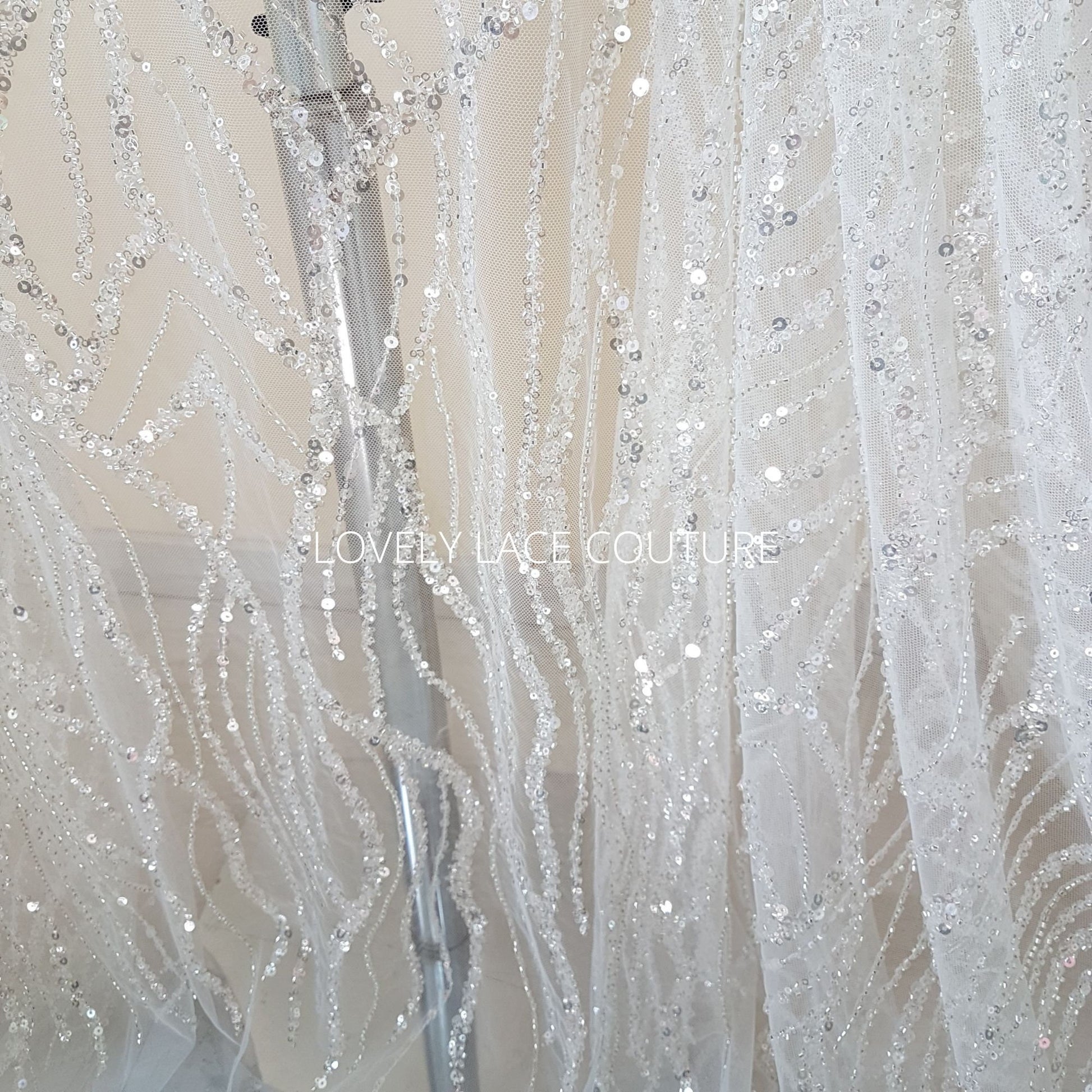 lace fabric wave pattern in off-white and blue color