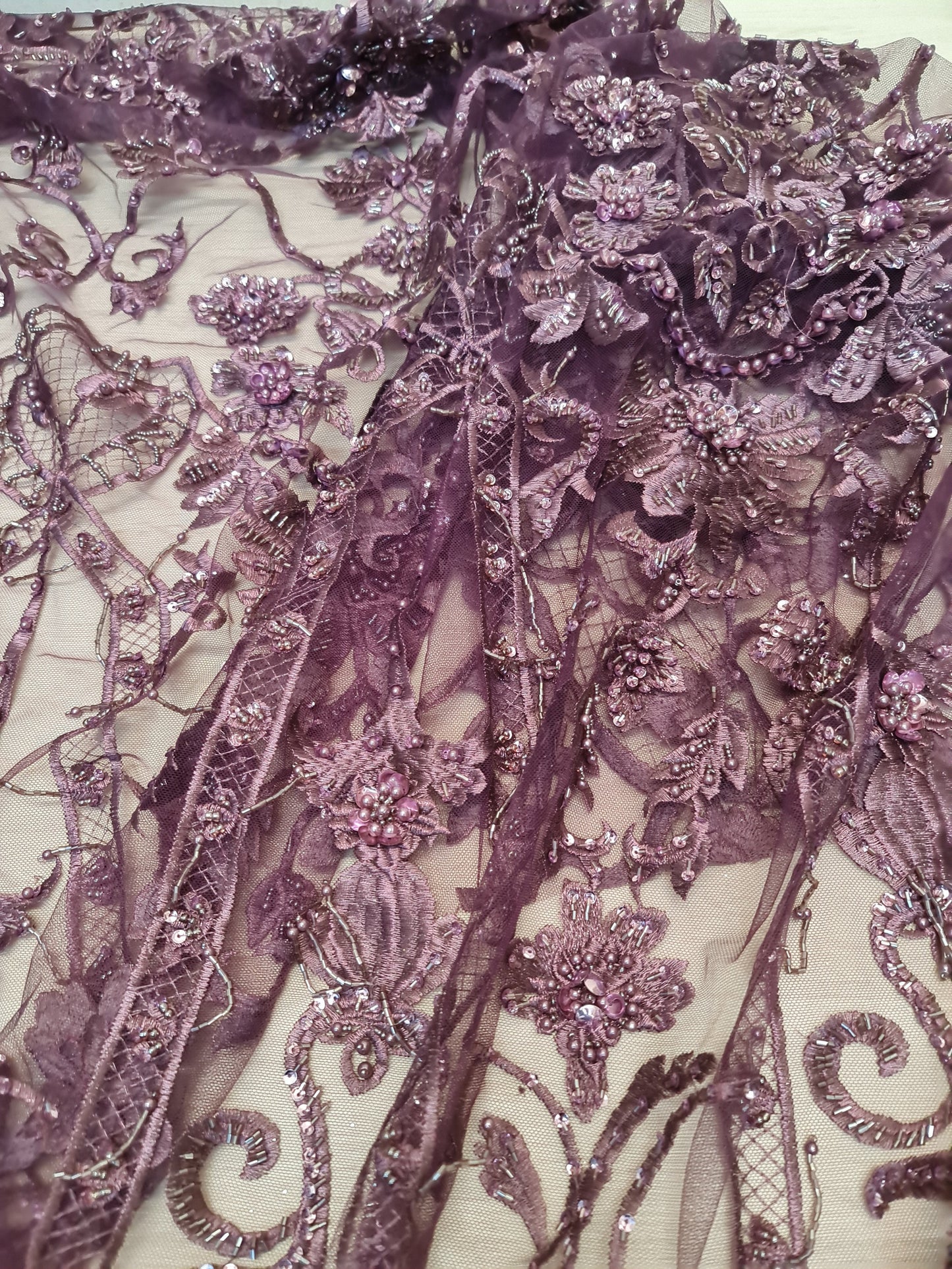 lace fabric on floor in purple color, geometrical design
