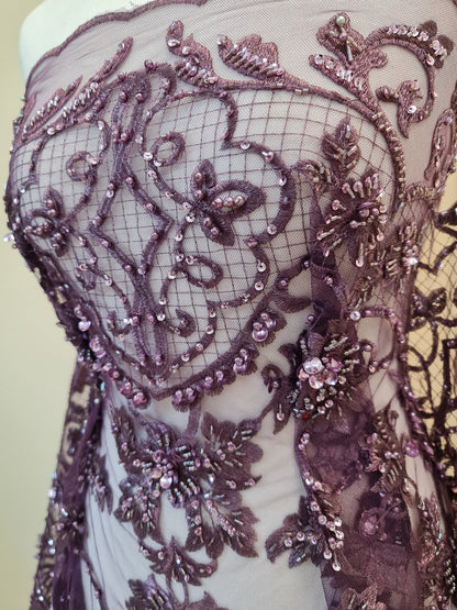 close up, lace fabric in purple color on dressform from upper part