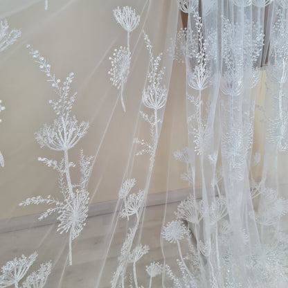 lace fabric with dandelion pattern in off-white color