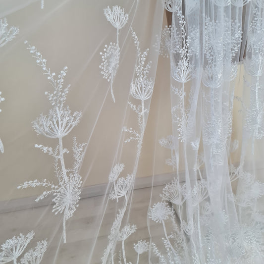 lace fabric with dandelion pattern in off-white color