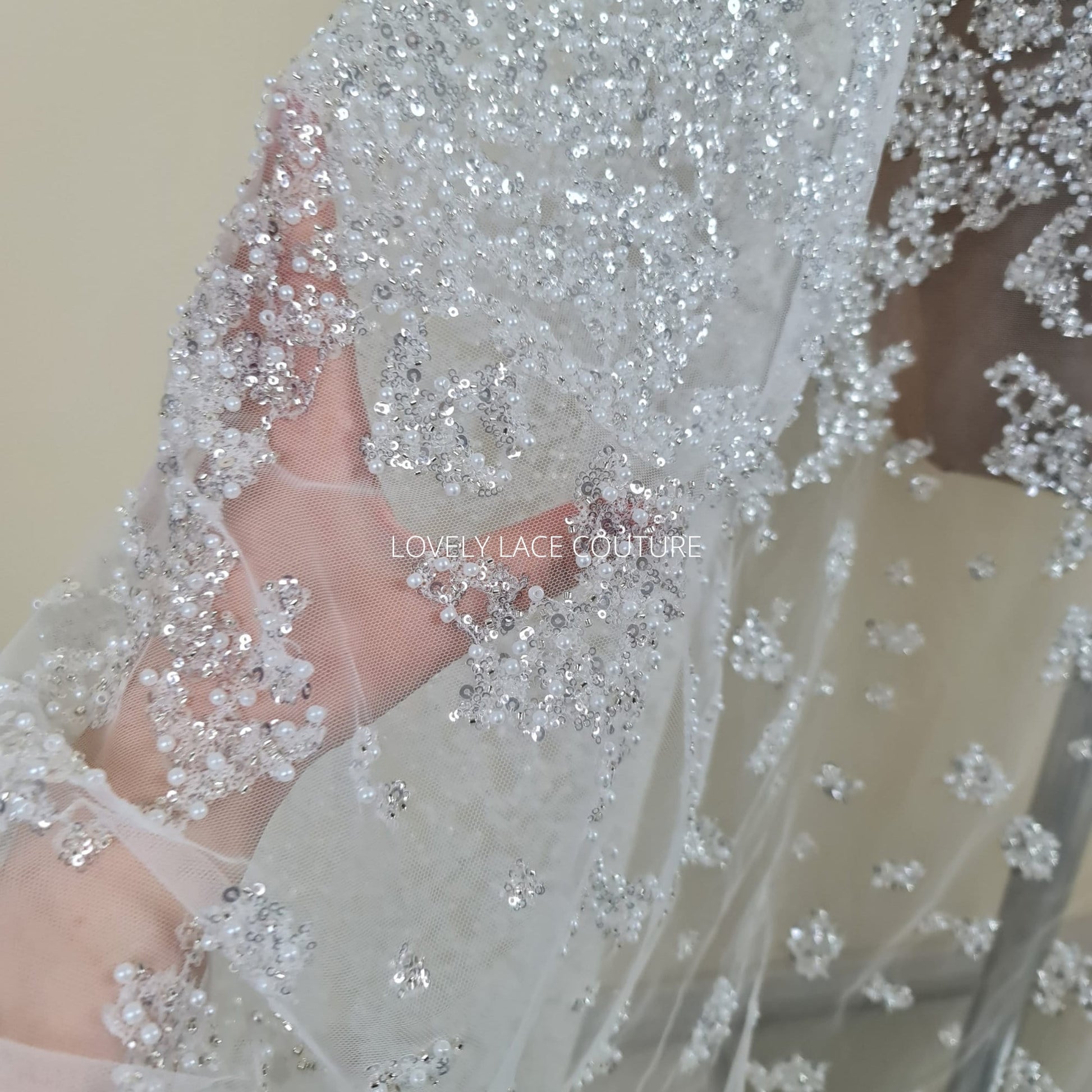 lace fabric with beads and silver sequins in off-white color