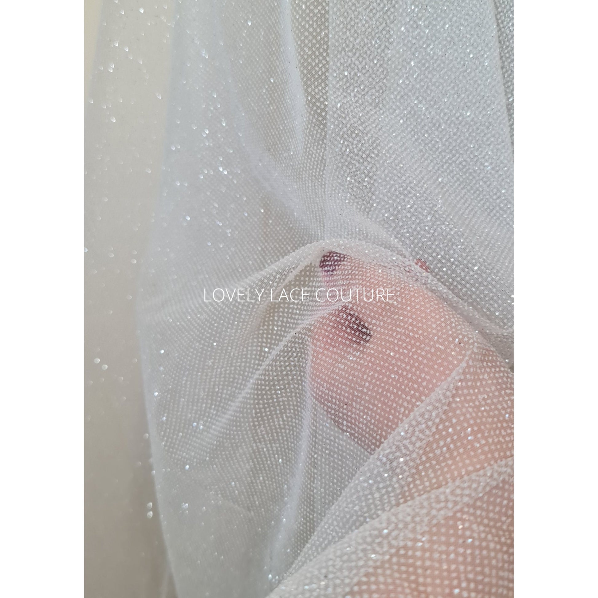 beautiful sparkling glitter tulle fabric in off-white LL-1499 or ivory color LL-1500 for marvelous bridal and wedding dresses or also veils