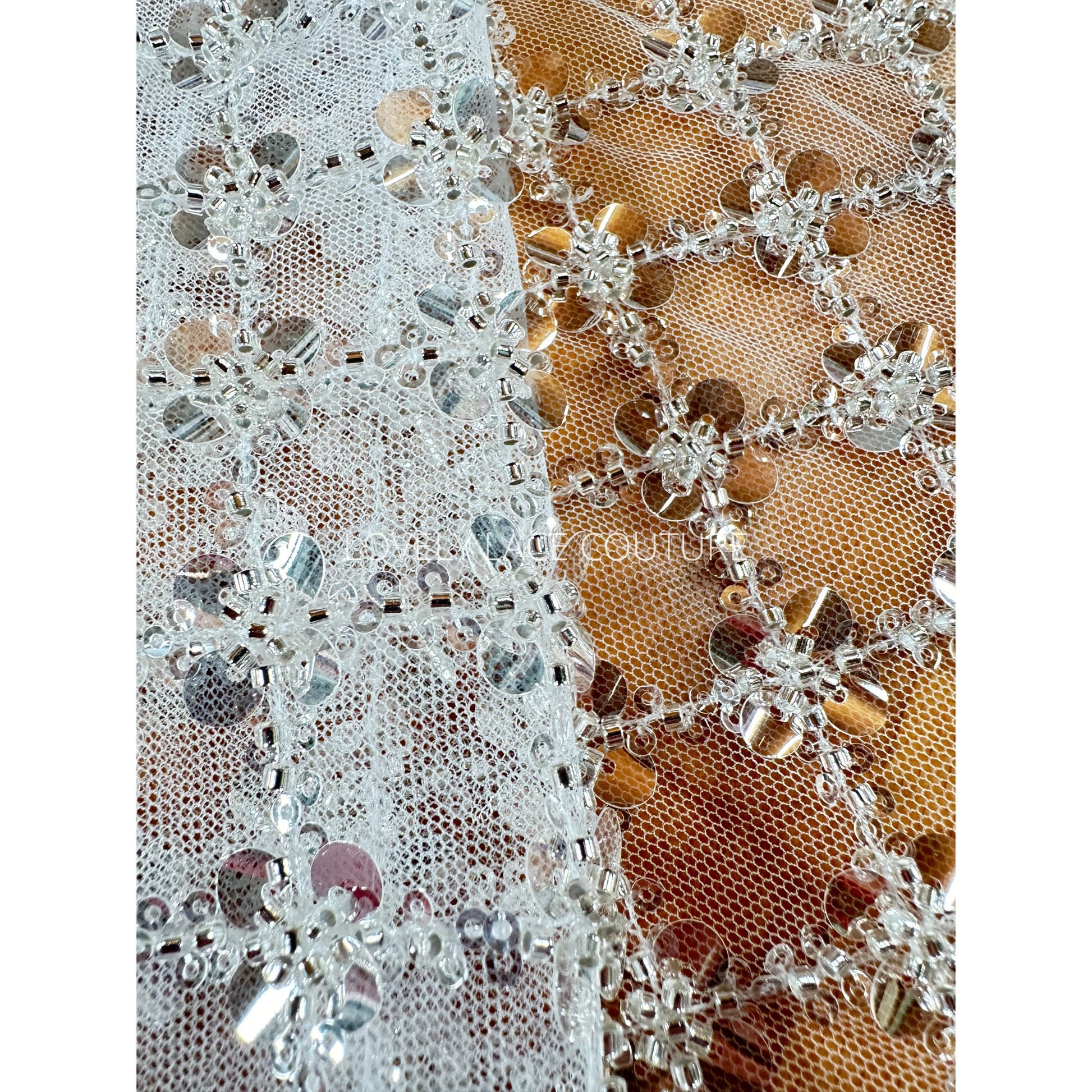 closer picture of the beads and big and small transparent sequins that are shown on the picture