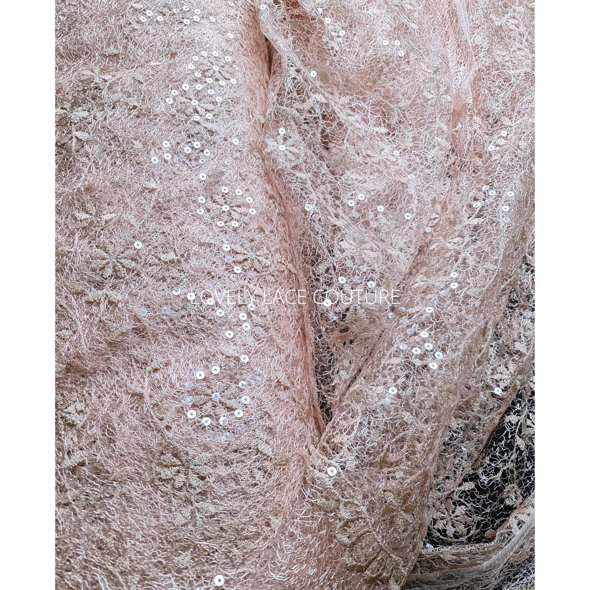 delicate lace fabric with allover abstract flower design in roségold color