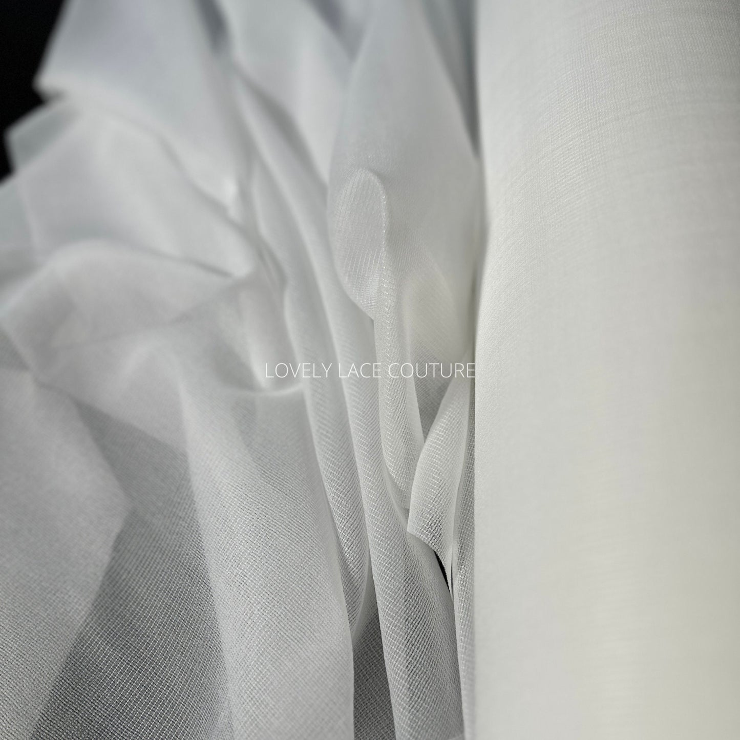 bolt off-white color, iron-on fabric lining, shown as bolt and folded