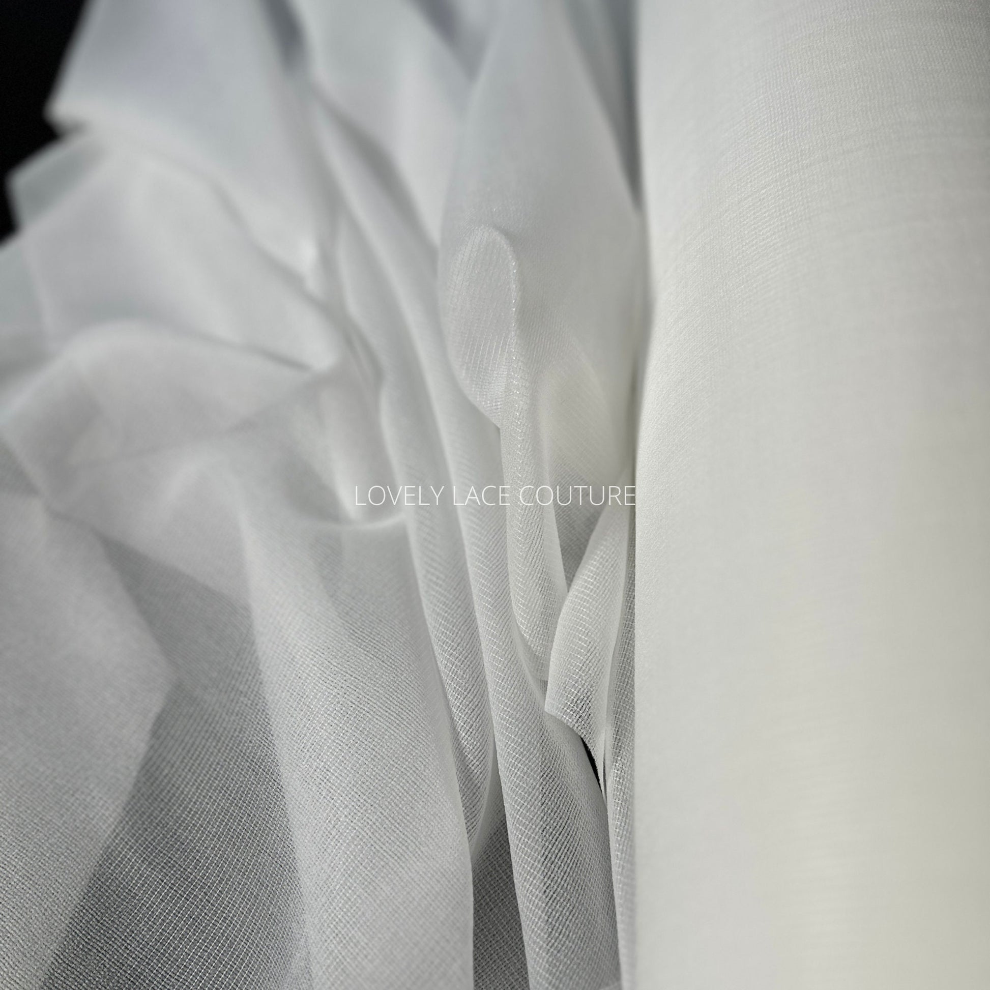 bolt off-white color, iron-on fabric lining, shown as bolt and folded