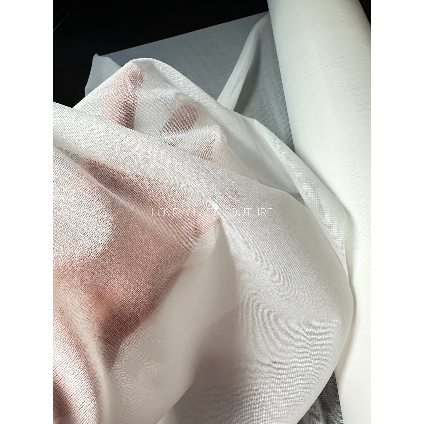 fusible fabric lining in off-white, showed on hand