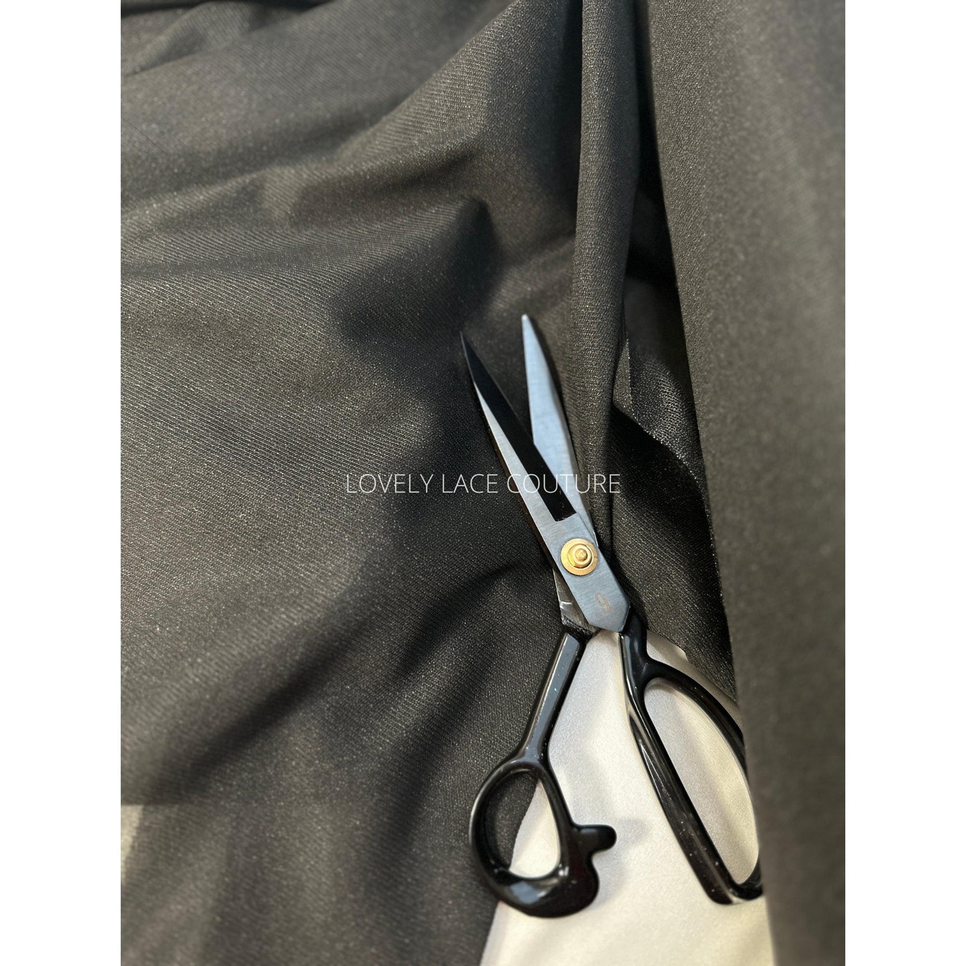 bolt black color, iron-on fabric lining, shown as bolt and folded