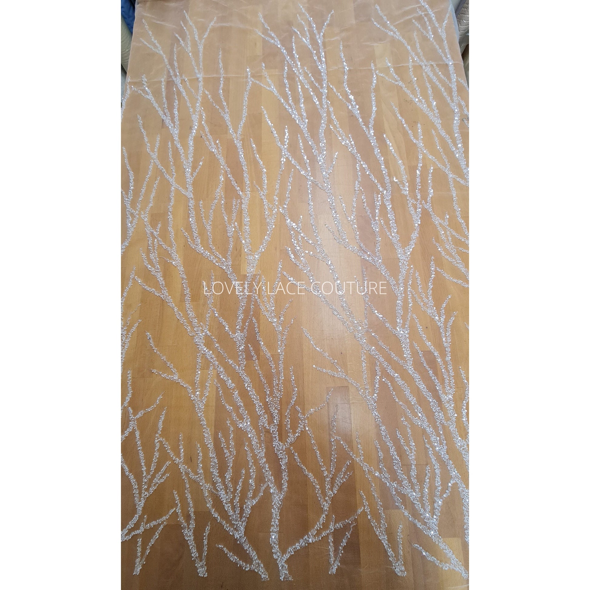 LL-1180 beautiful sparkling lace fabric with a modern abstract branch pattern in off-white color, starts at 0,5m