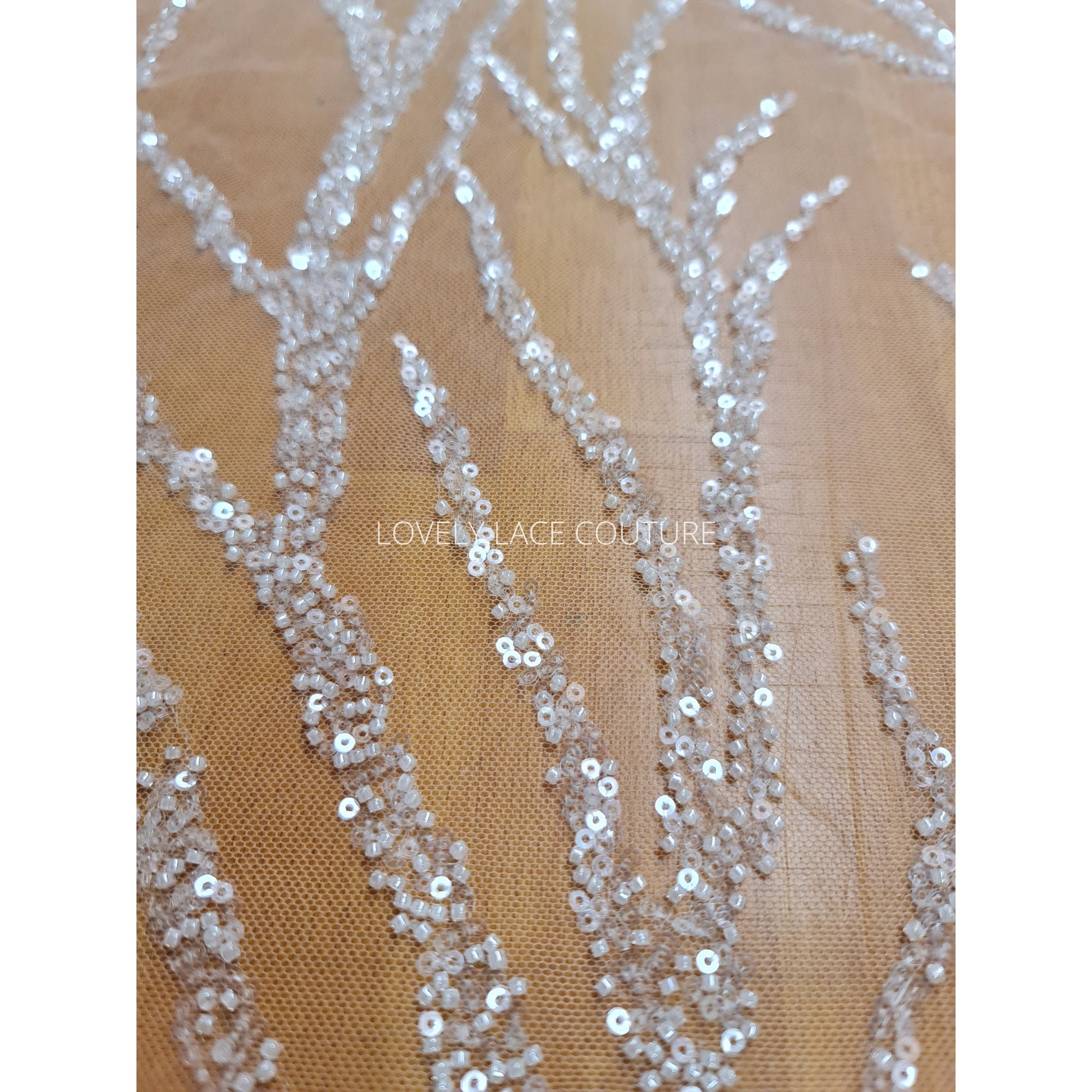 LL-1180 beautiful sparkling lace fabric with a modern abstract branch pattern in off-white color, starts at 0,5m