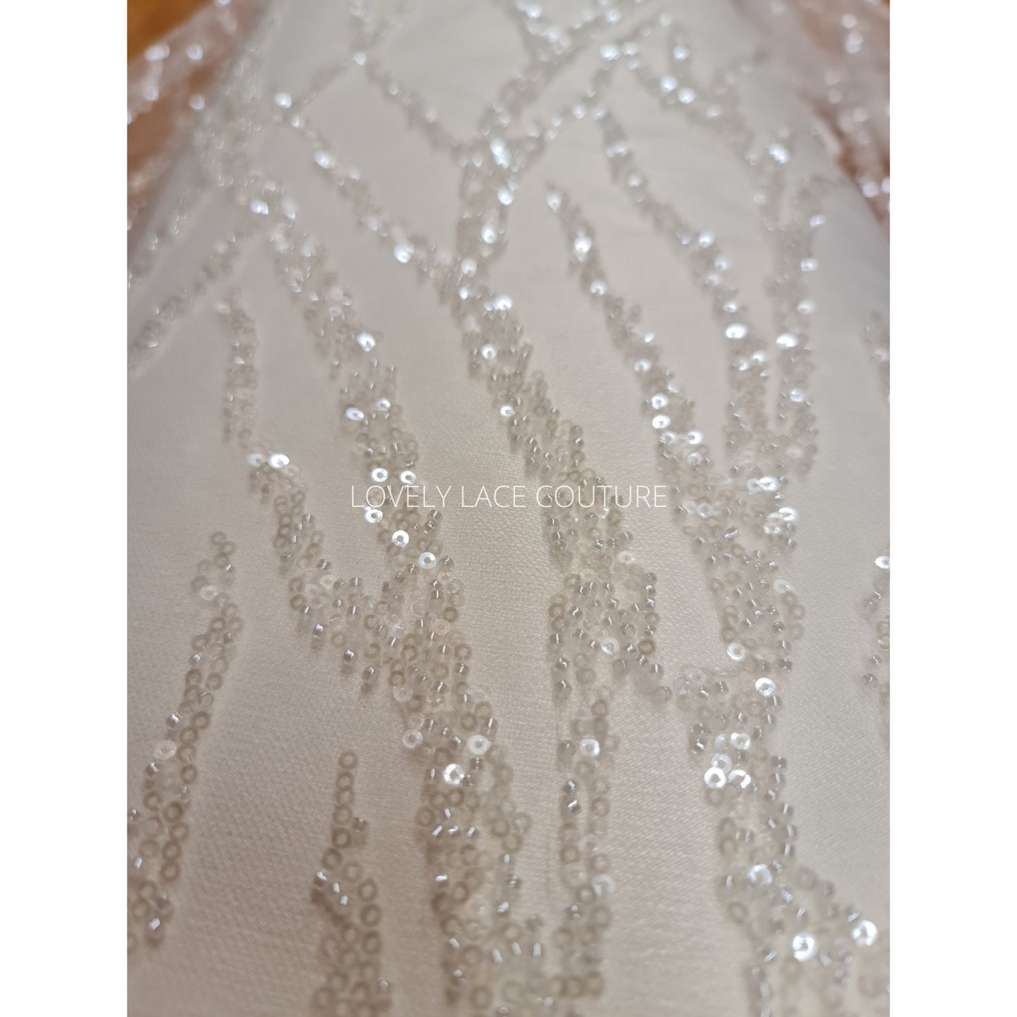 LL-1180 beautiful sparkling lace fabric with a modern abstract branch pattern in off-white color, starts at 0,5m