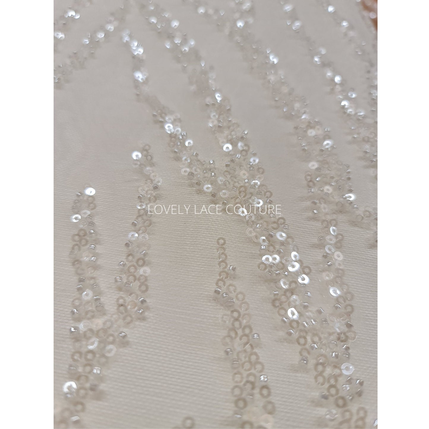 LL-1180 beautiful sparkling lace fabric with a modern abstract branch pattern in off-white color, starts at 0,5m