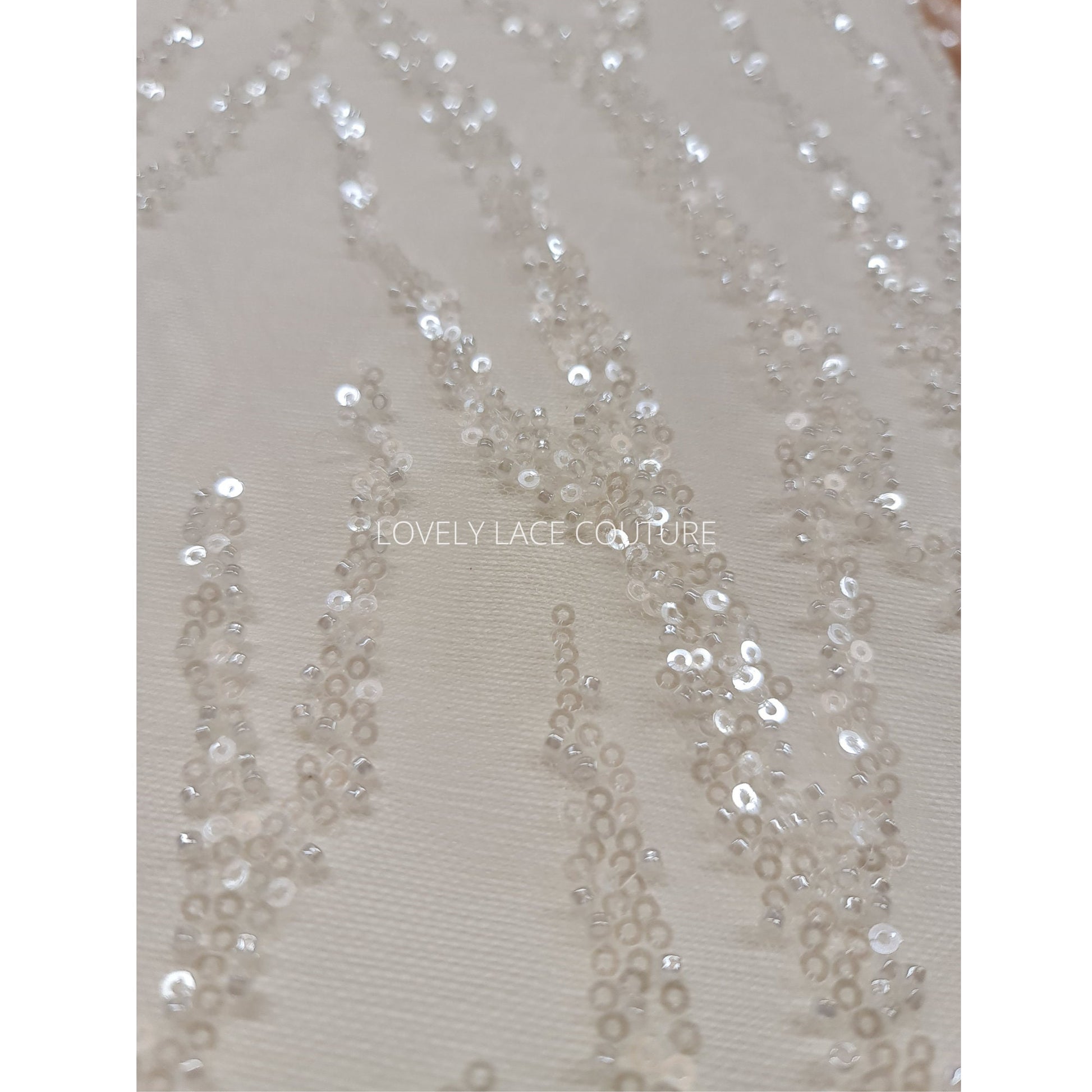 LL-1180 beautiful sparkling lace fabric with a modern abstract branch pattern in off-white color, starts at 0,5m