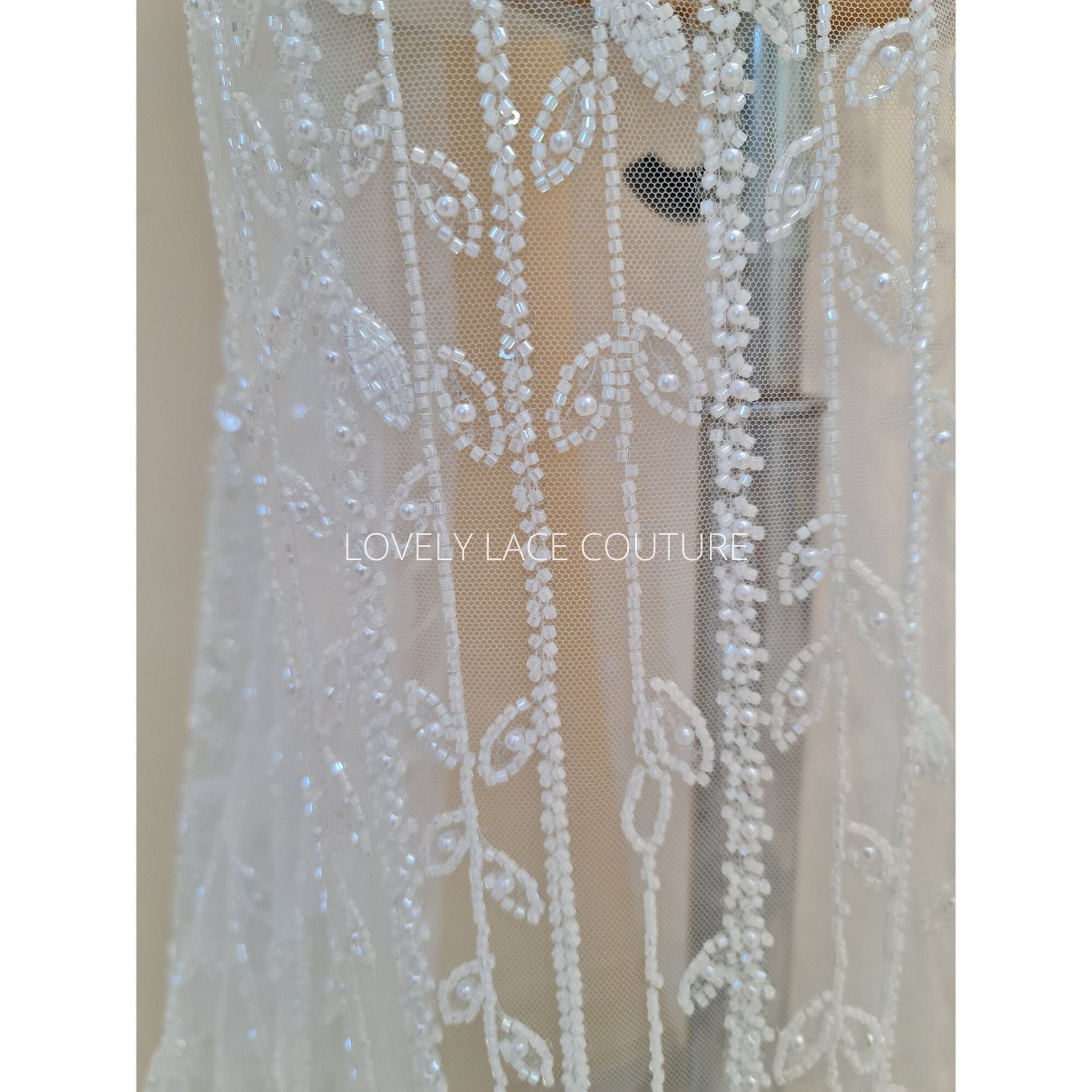 beaded lace fabric with leaves in white color
