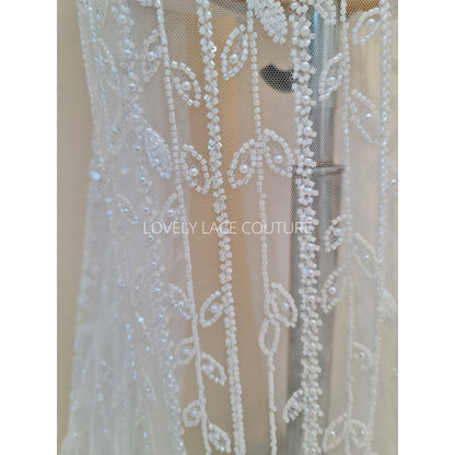 beaded lace fabric with leaves in white color