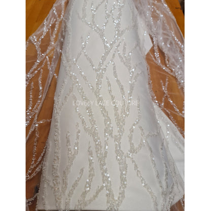 lace fabric with beads and transparent sequins in off-white color with branch pattern, lace on satinfabric for bridal and wedding dresses