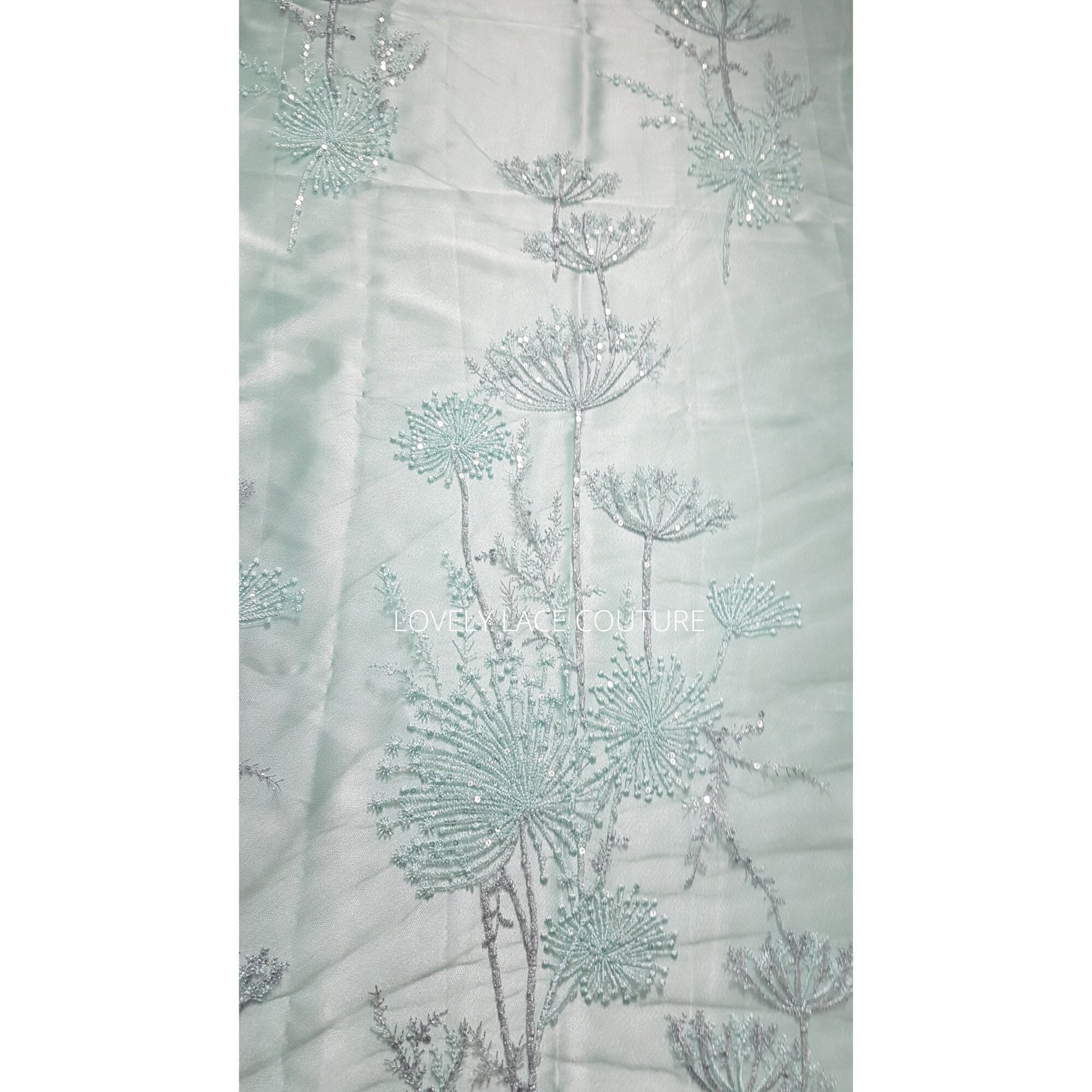 lace fabric with dandelion pattern in mint color
