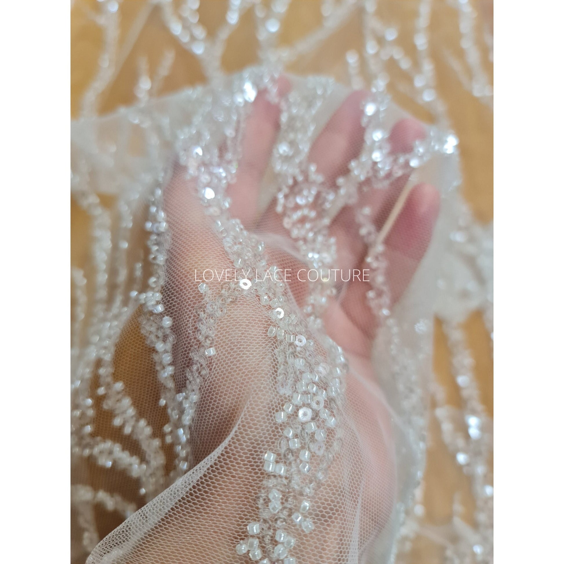LL-1180 beautiful sparkling lace fabric with a modern abstract branch pattern in off-white color, starts at 0,5m