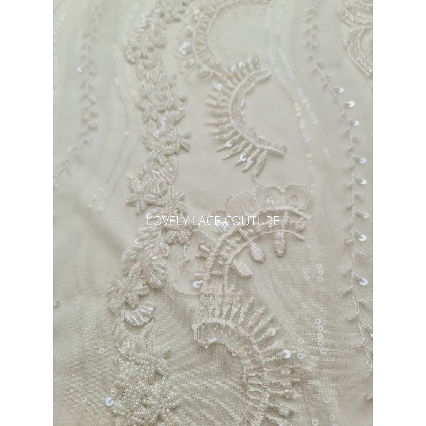 lace fabric with beads and transparent sequins for bridal wear in off-white and rosécolor