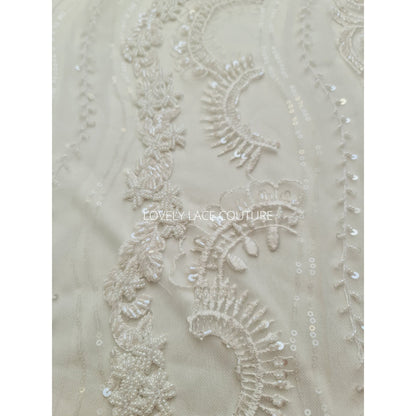 lace fabric with beads and transparent sequins for bridal wear in off-white and rosécolor