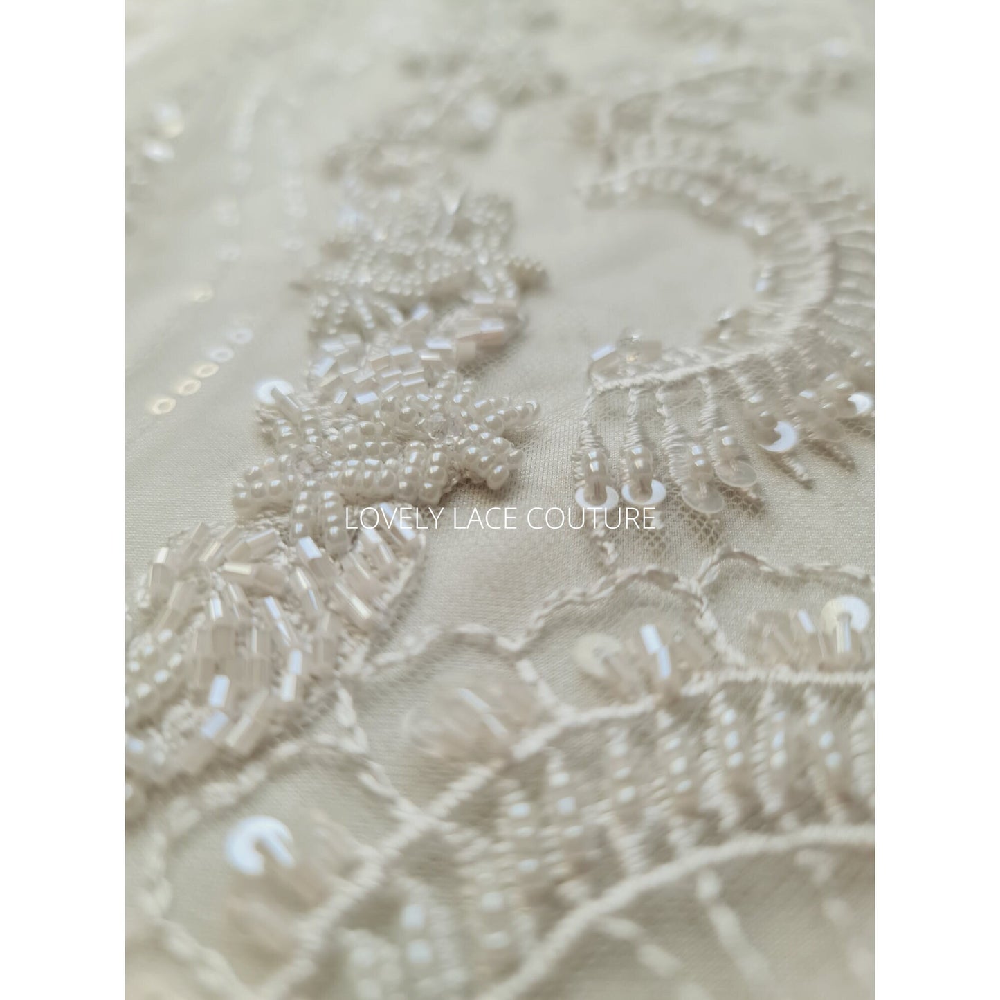 lace fabric with beads and transparent sequins for bridal wear in off-white and rosécolor