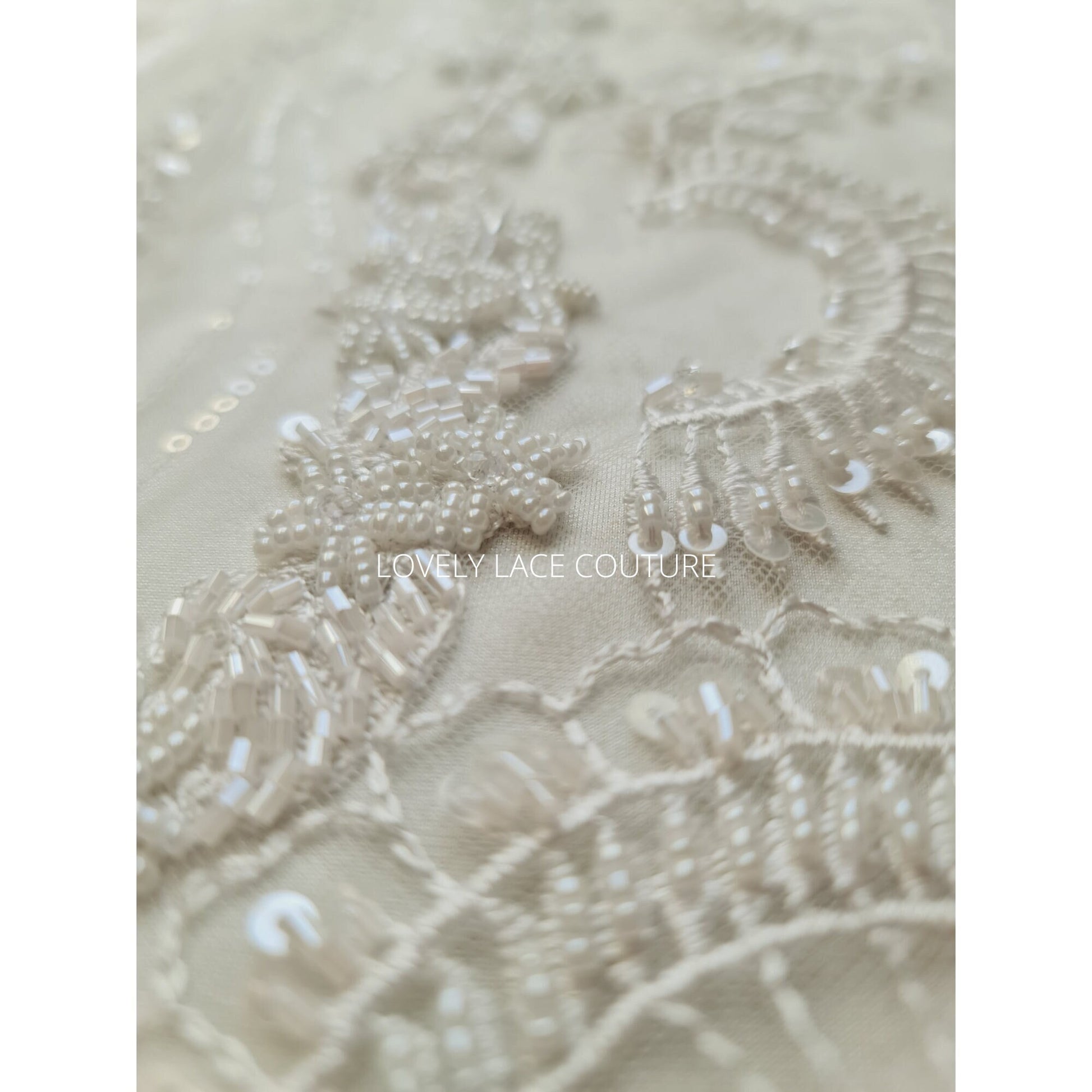 lace fabric with beads and transparent sequins for bridal wear in off-white and rosécolor