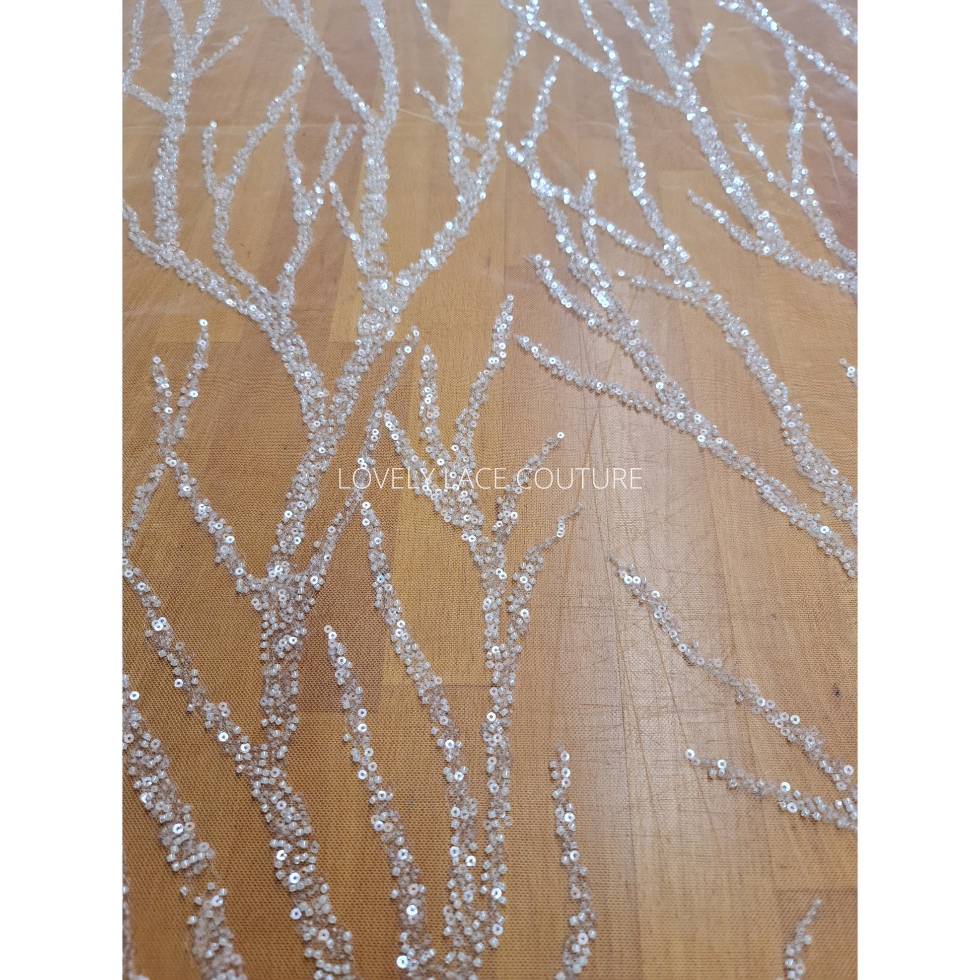 lace fabric in off-white color, abstract design
