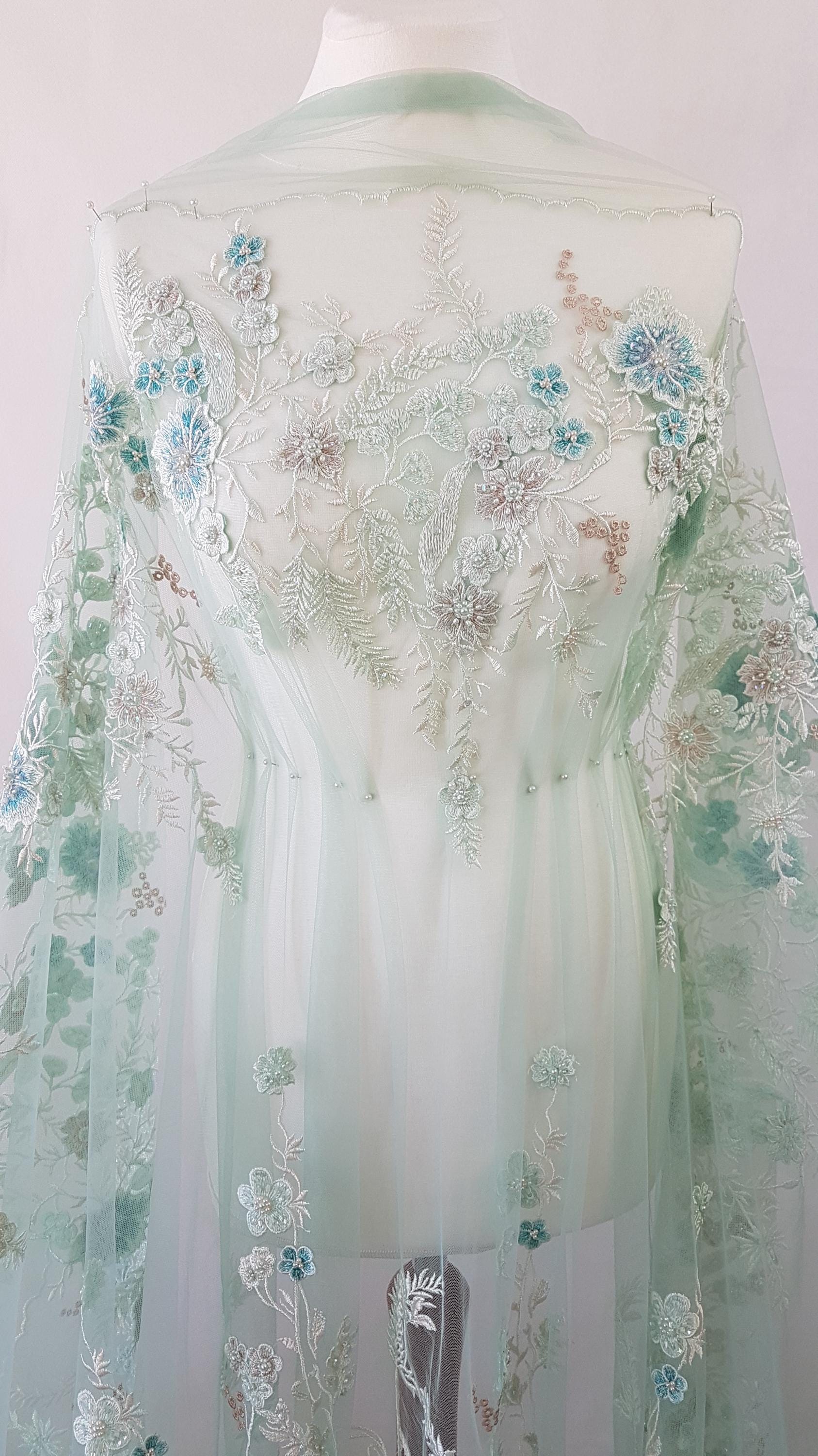 lace fabric draped on dressform